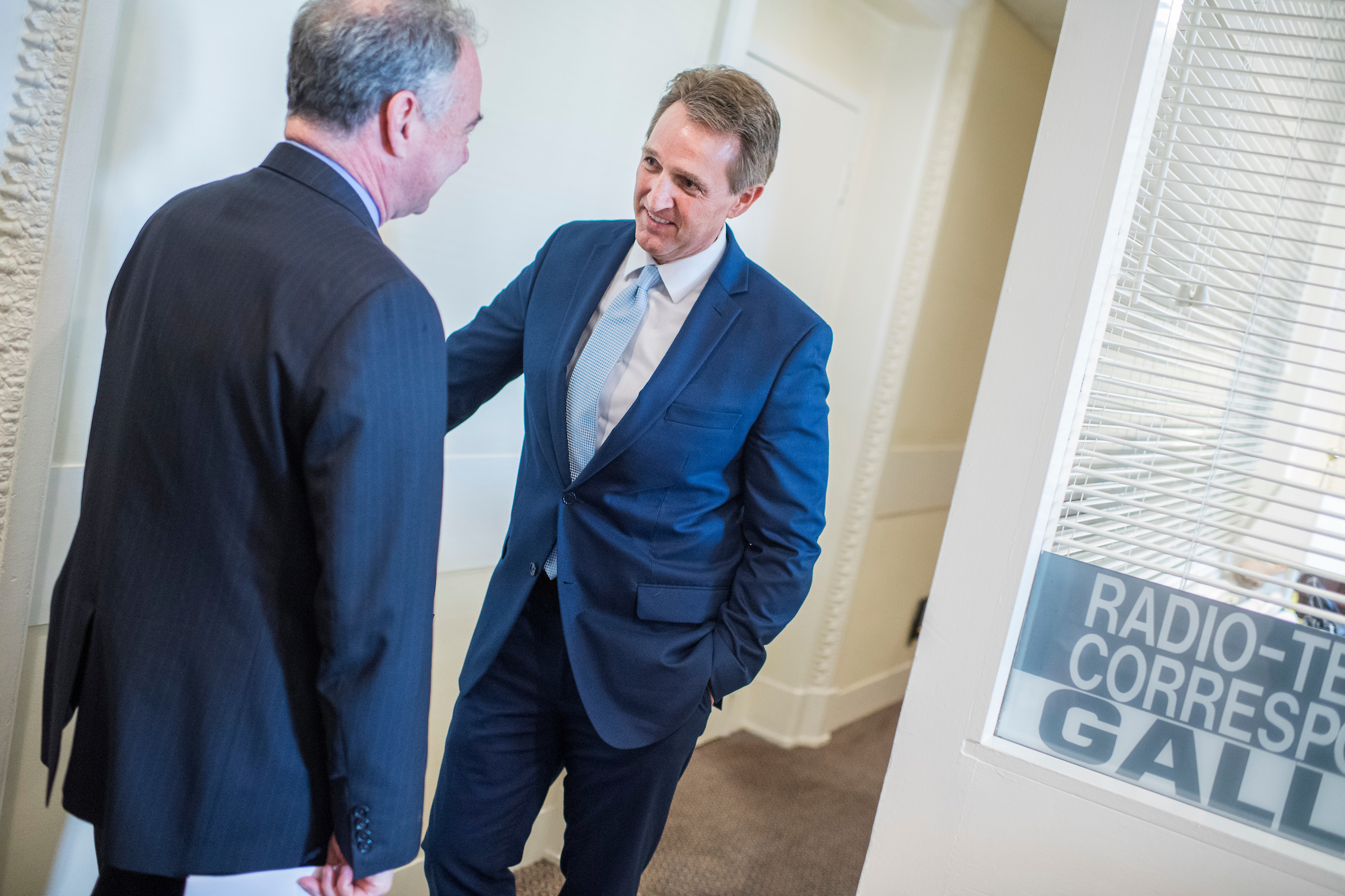 Sens. <a class="memberLink" title="Click to view member info in a new window" href="http://data.rollcall.com/members/24568?rel=memberLink" target="_blank">Tim Kaine</a> of Virginia, left, and <a class="memberLink" title="Click to view member info in a new window" href="http://data.rollcall.com/members/7588?rel=memberLink" target="_blank">Jeff Flake</a> of Arizona prepare for a news conference on Thursday in the Capitol to introduce an authorization for use of military force, or AUMF, against the Islamic State, al-Qaida, and the Taliban. (Tom Williams/CQ Roll Call)