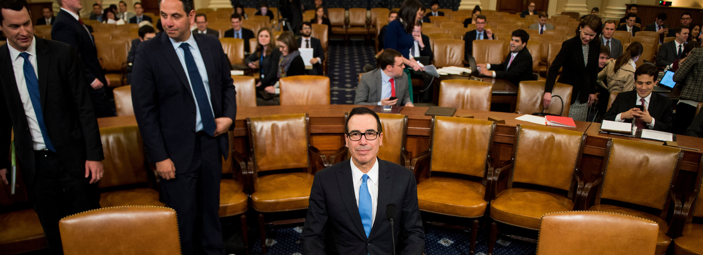 Treasury Secretary Steven Mnuchin takes his seat at the witness table before the start of the House Ways and Means Committee hearing on Trump'’s budget proposals for fiscal 2018 on Wednesday. (Bill Clark/CQ Roll Call)