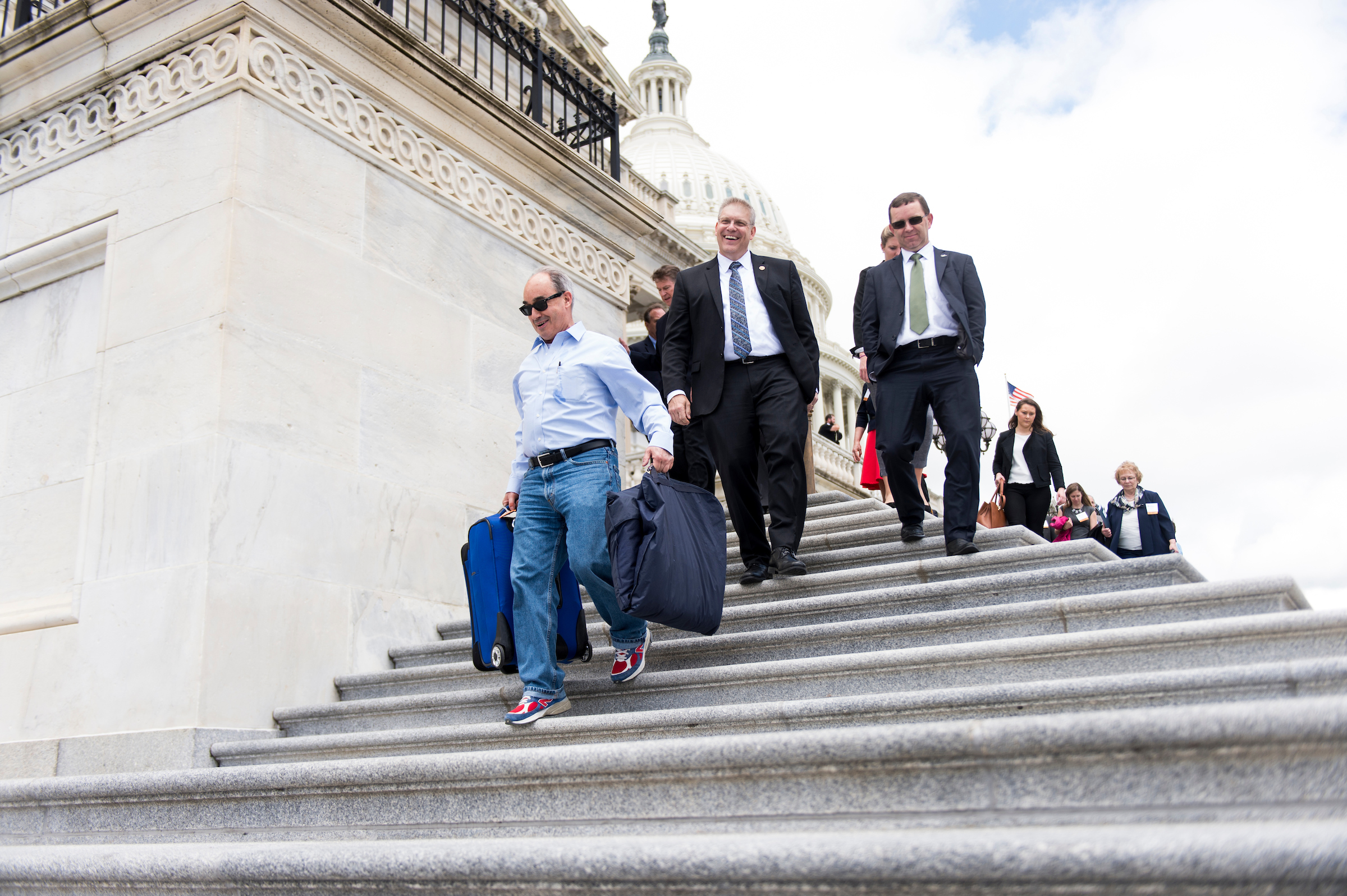 UNITED STATES - MAY 25: Rep. Bruce Poliquin, R-Maine, carries his luggage as he leaves the Capitol for the Memorial Day recess following the final votes of the week on Thursday, May 25, 2017. (Photo By Bill Clark/CQ Roll Call)