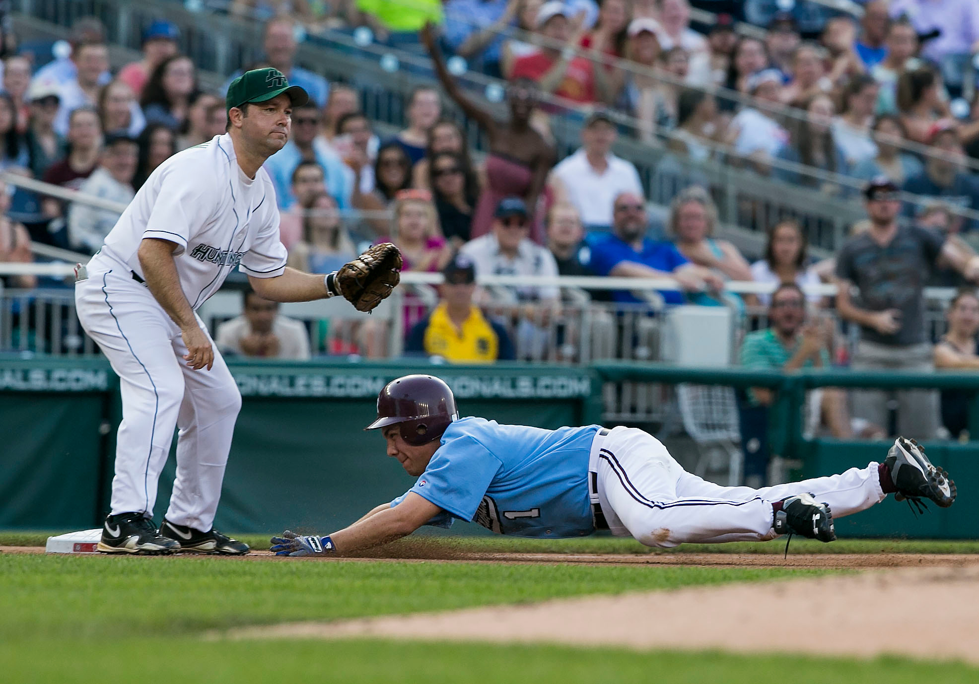 UNITED STATES - JUNE 11 - Rep. Pete Aguilar, D-Calif., slides safely into third base as Rep. Marlin Stutzman, R-Ind., waits for the ball during the 54th Annual Roll Call Congressional Baseball Game at Nationals Park in Washington on Thursday, June 11, 2015. The Democrats beat the Republicans 5-2. (Photo By Al Drago/CQ Roll Call)