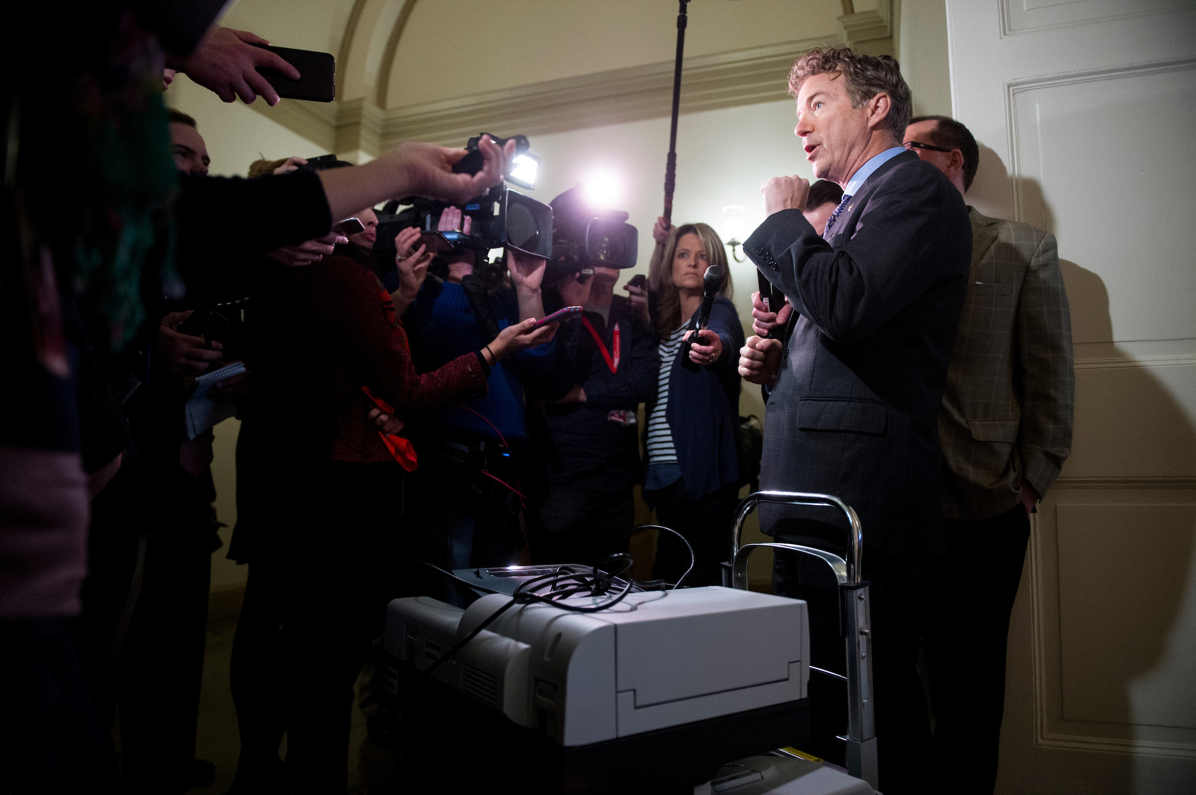 Sen. Rand Paul, R-Ky., stands with his copier on a cart as he speaks to reporters after trying to gain access to the room housing the House Republicans' secret health care plan in the Capitol on Thursday, March 2, 2017. Sen. Paul hoped to make copies of the House Republicans' health care plan. (Photo By Bill Clark/CQ Roll Call)