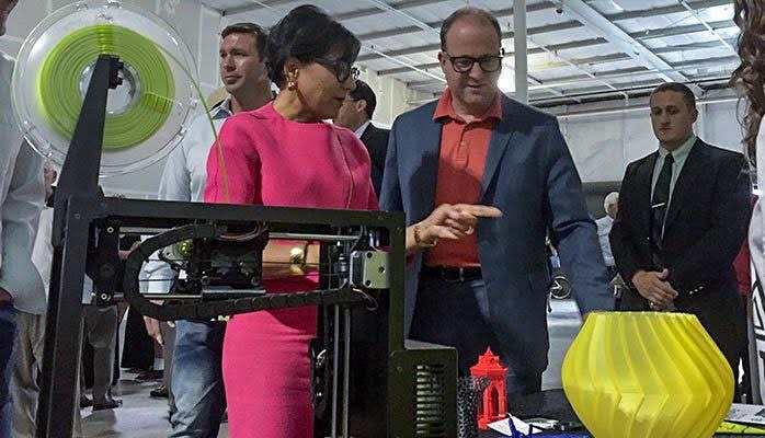 For last year’s Startup Day, Polis checked out a 3D printer with then-Commerce Secretary Penny Pritzker. (Courtesy Polis’ office)
