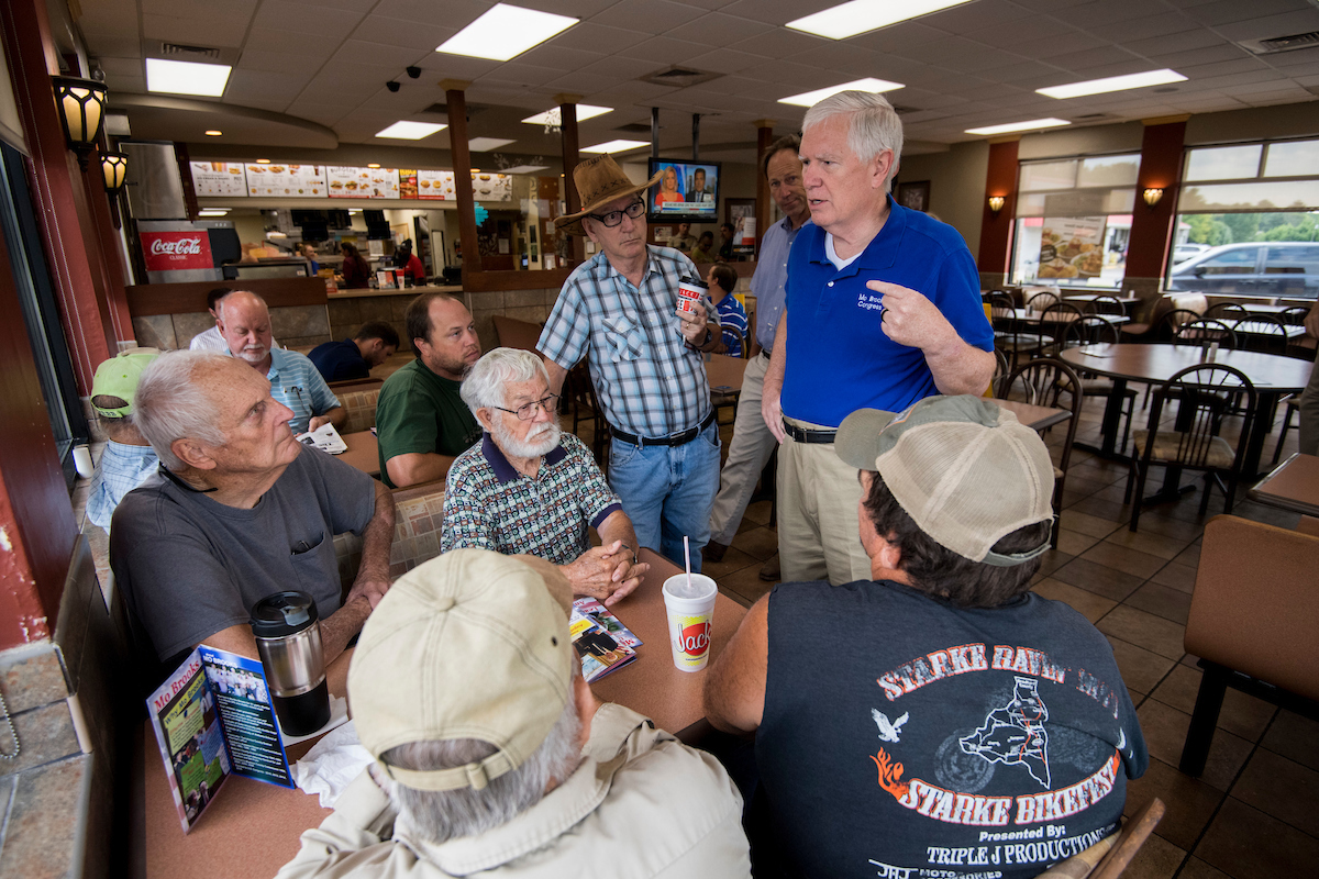 Brooks speaks with diners at Jack’s, a hamburger chain restaurant, during a bus tour stop in Munford, Alabama. (Bill Clark/CQ Roll Call)