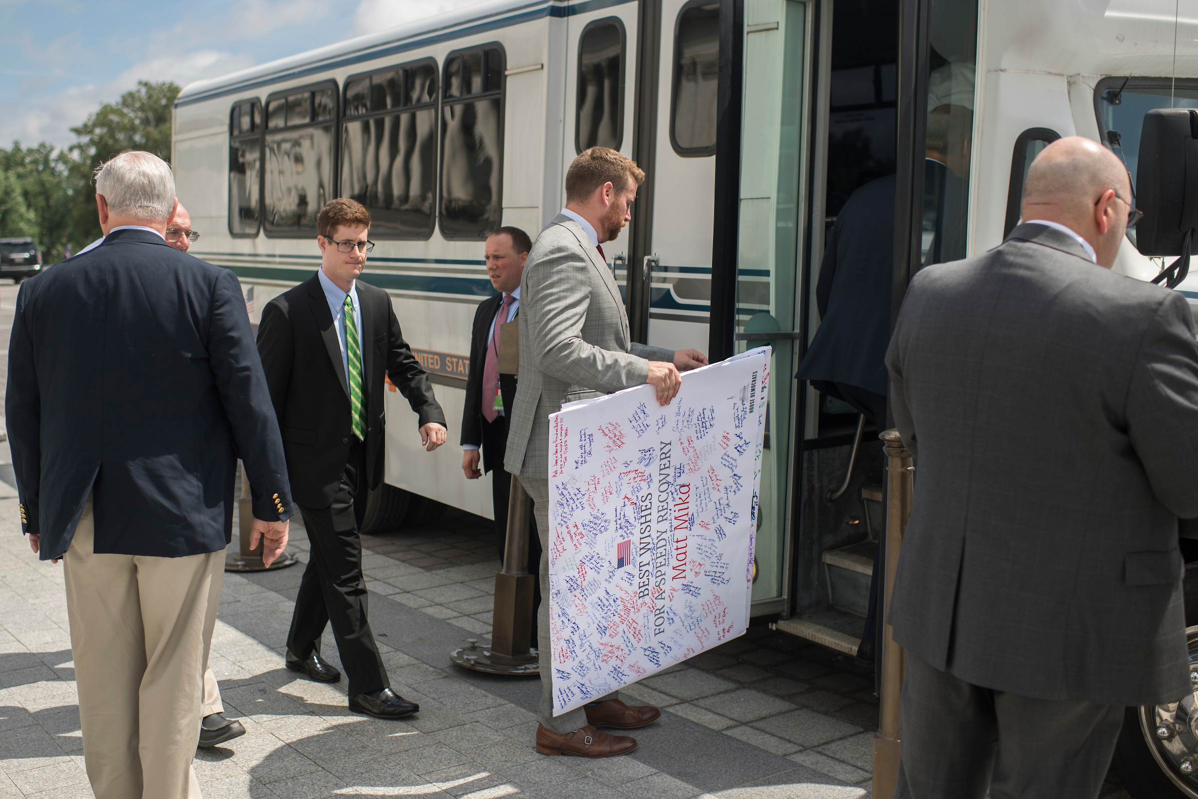 Barth boards a bus along with aides and lawmakers on the East Front of the Capitol to visit Matt Mika in the hospital on June 23. Mika, a lobbyist, was also shot and wounded in the June 14 attack at the Republicans’ baseball practice. (Tom Williams/CQ Roll Call File Photo)