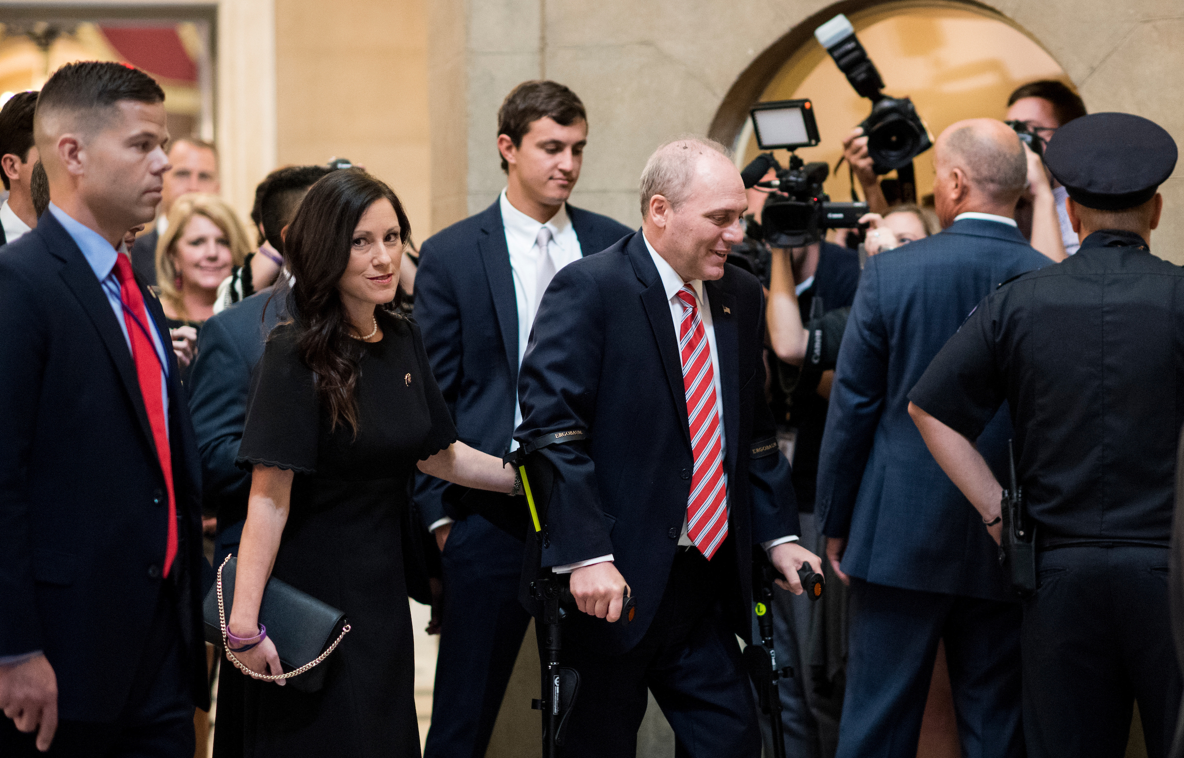 UNITED STATES - SEPTEMBER 28: House Majority Whip Steve Scalise, R-La., walks with his wife Jennifer from the House chamber to his office in the Capitol on his first day back in Congress on Thursday, Sept. 28, 2017. Scales was shot during baseball practice for the Congressional Baseball Game in June. (Photo By Bill Clark/CQ Roll Call)