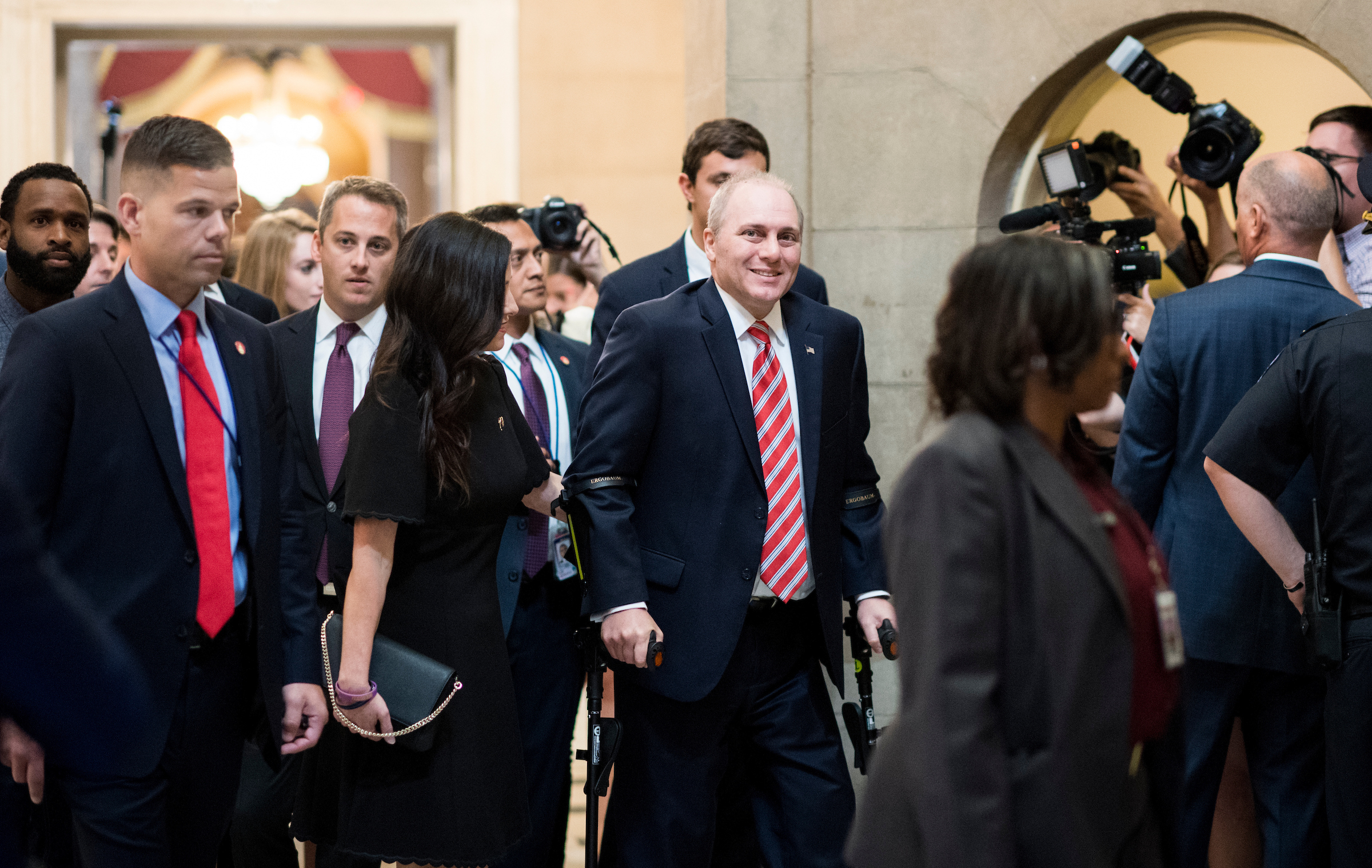 UNITED STATES - SEPTEMBER 28: House Majority Whip Steve Scalise, R-La., walks with his wife Jennifer from the House chamber to his office in the Capitol on his first day back in Congress on Thursday, Sept. 28, 2017. Scales was shot during baseball practice for the Congressional Baseball Game in June. (Photo By Bill Clark/CQ Roll Call)