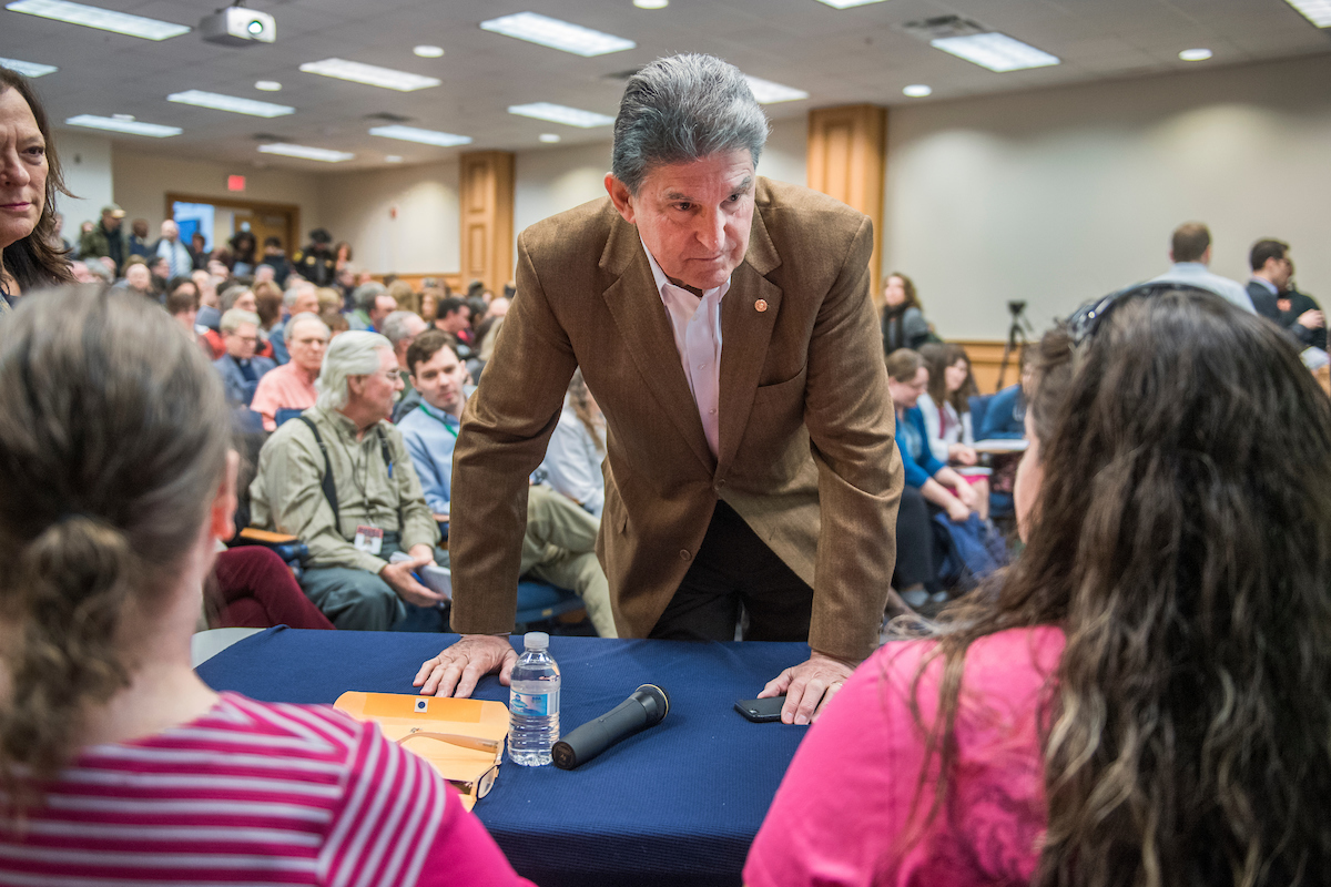 West Virginia Sen. Joe Manchin III talks with constituents during a town hall meeting in Martinsburg, W.Va., last week. (Tom Williams/CQ Roll Call)