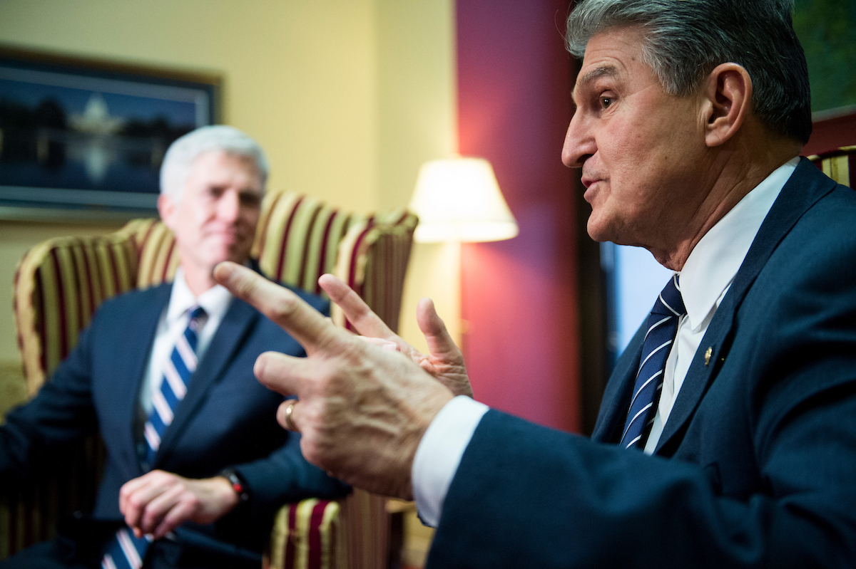 Sen. Joe Manchin III, D-W. Va., right, will back limiting debate on Judge Neil Gorsuch’s nomination. (Bill Clark/CQ Roll Call file photo)