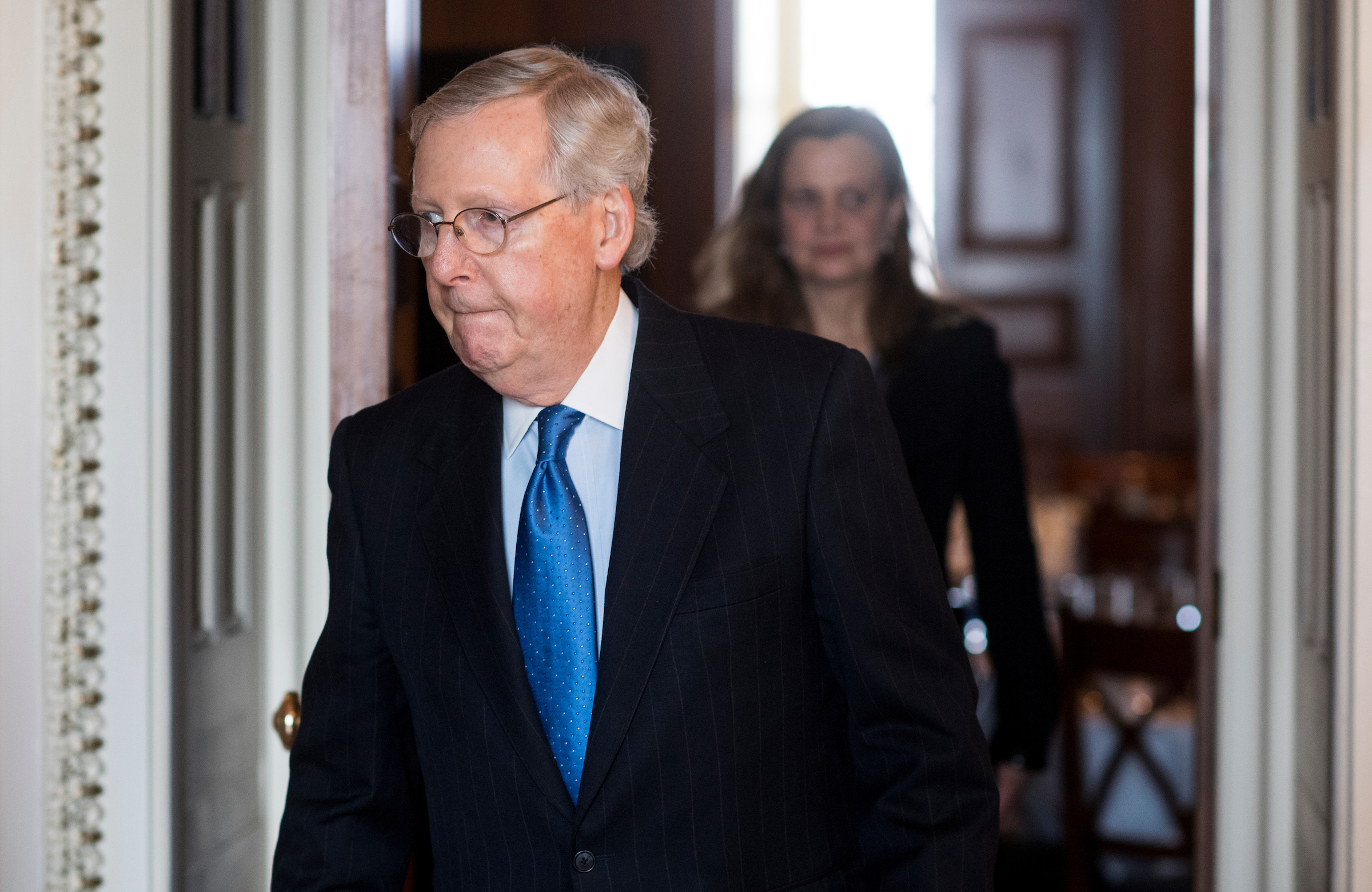 Senate Majority Leader Mitch McConnell, R-Ky., heads to the Senate floor as he leaves the Senate Republicans' policy lunch on Tuesday, March 21, 2017. (Bill Clark/CQ Roll Call)