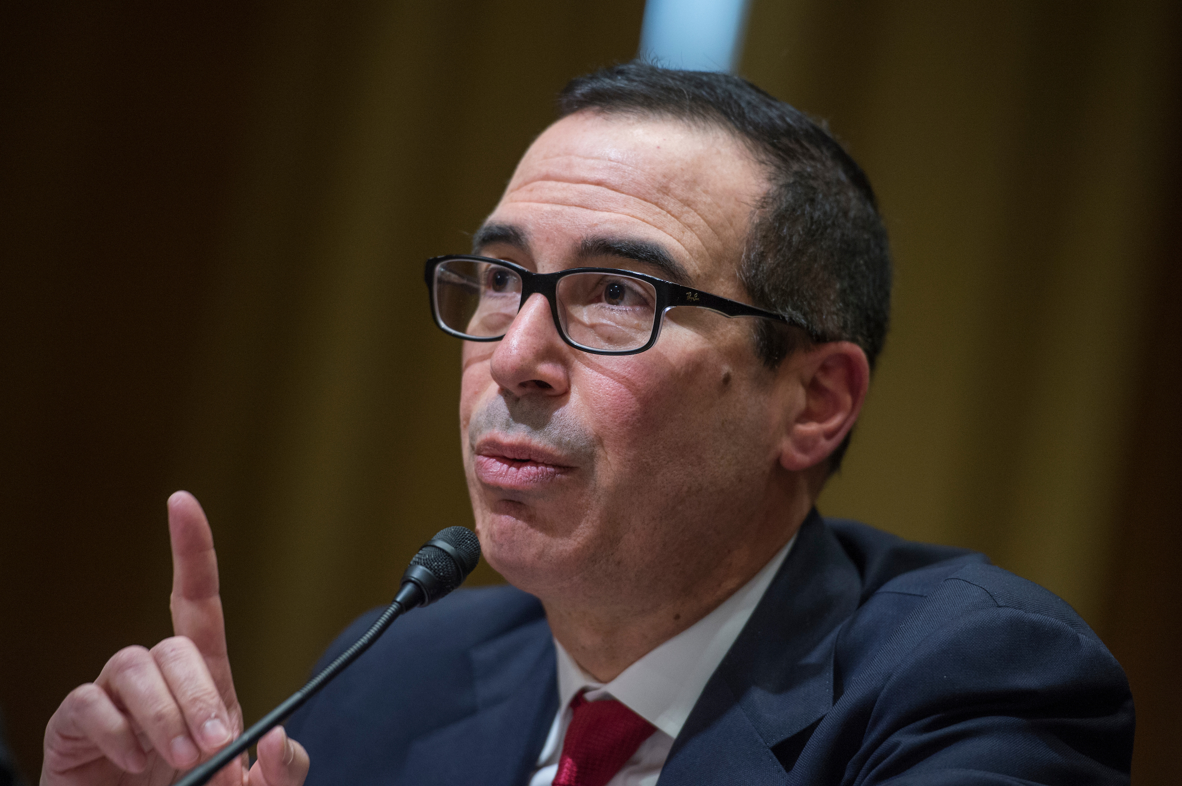 Treasury Secretary Steven Mnuchin on Friday declared himself “100 percent confident” that lawmakers and the White House will strike a debt ceiling-hiking deal next month. (Tom Williams/CQ Roll Call)