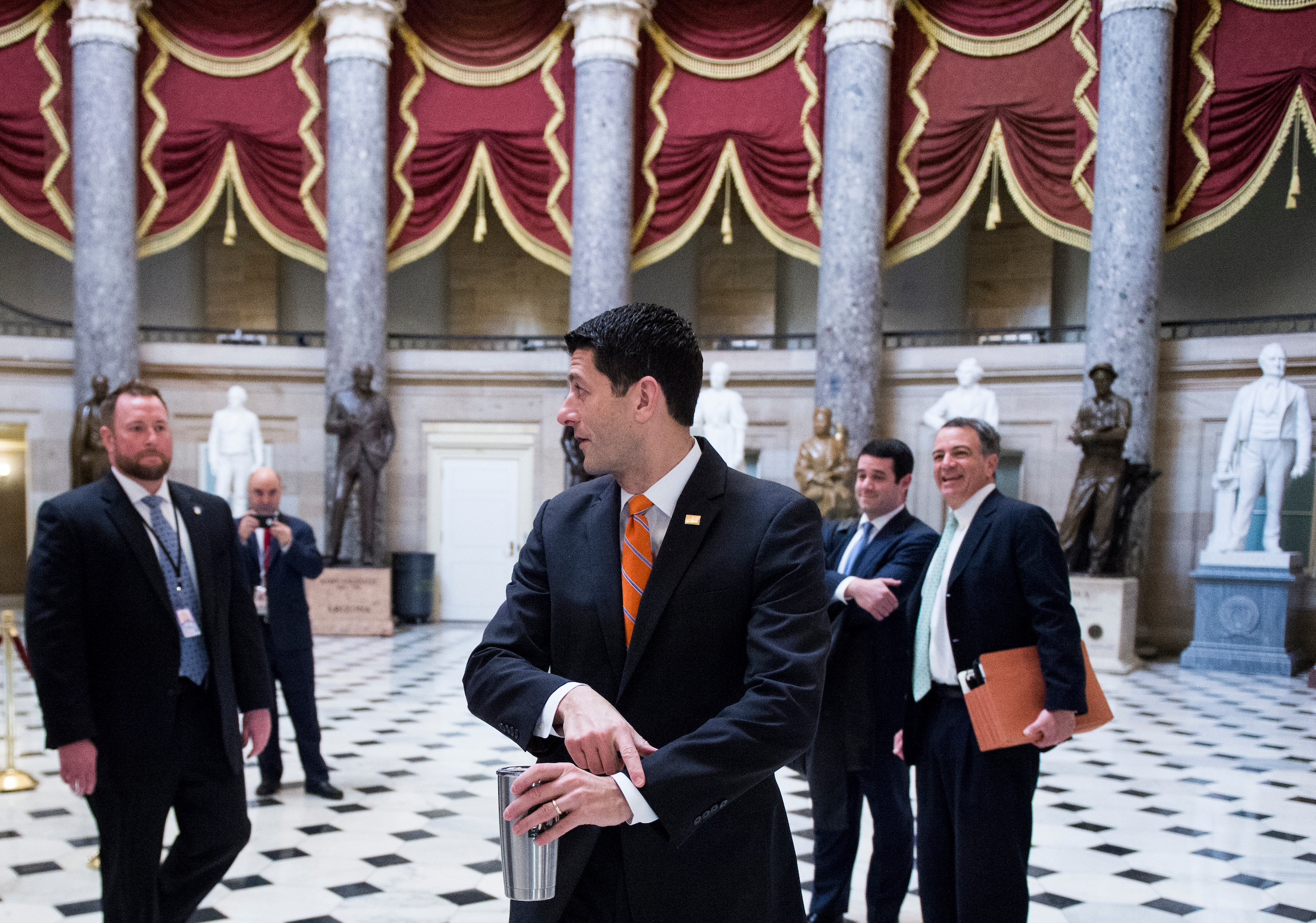 House Speaker Paul D. Ryan walks through Statuary Hall to the House floor in the Capitol on Thursday. (Bill Clark/CQ Roll Call)