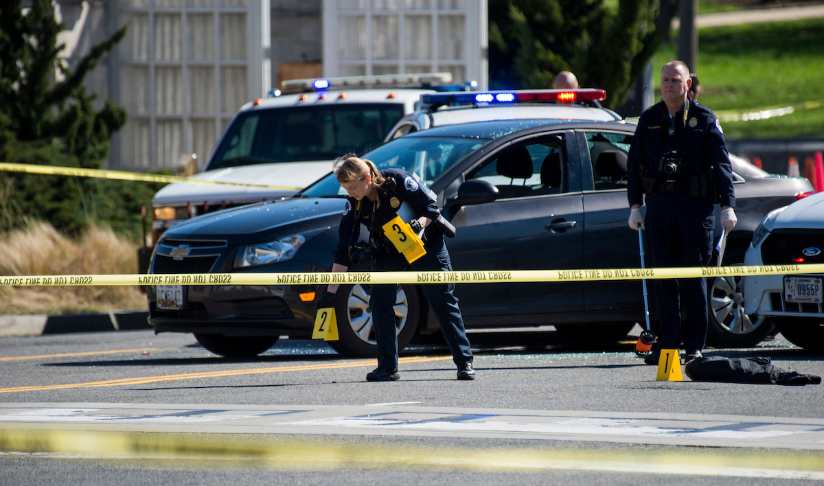 Police mark shell casings on Independence Avenue near the U.S. Capitol after a woman tried to ram a U.S. Capitol Police cruiser resulting in two officers firing shots. (Bill Clark/CQ Roll Call)