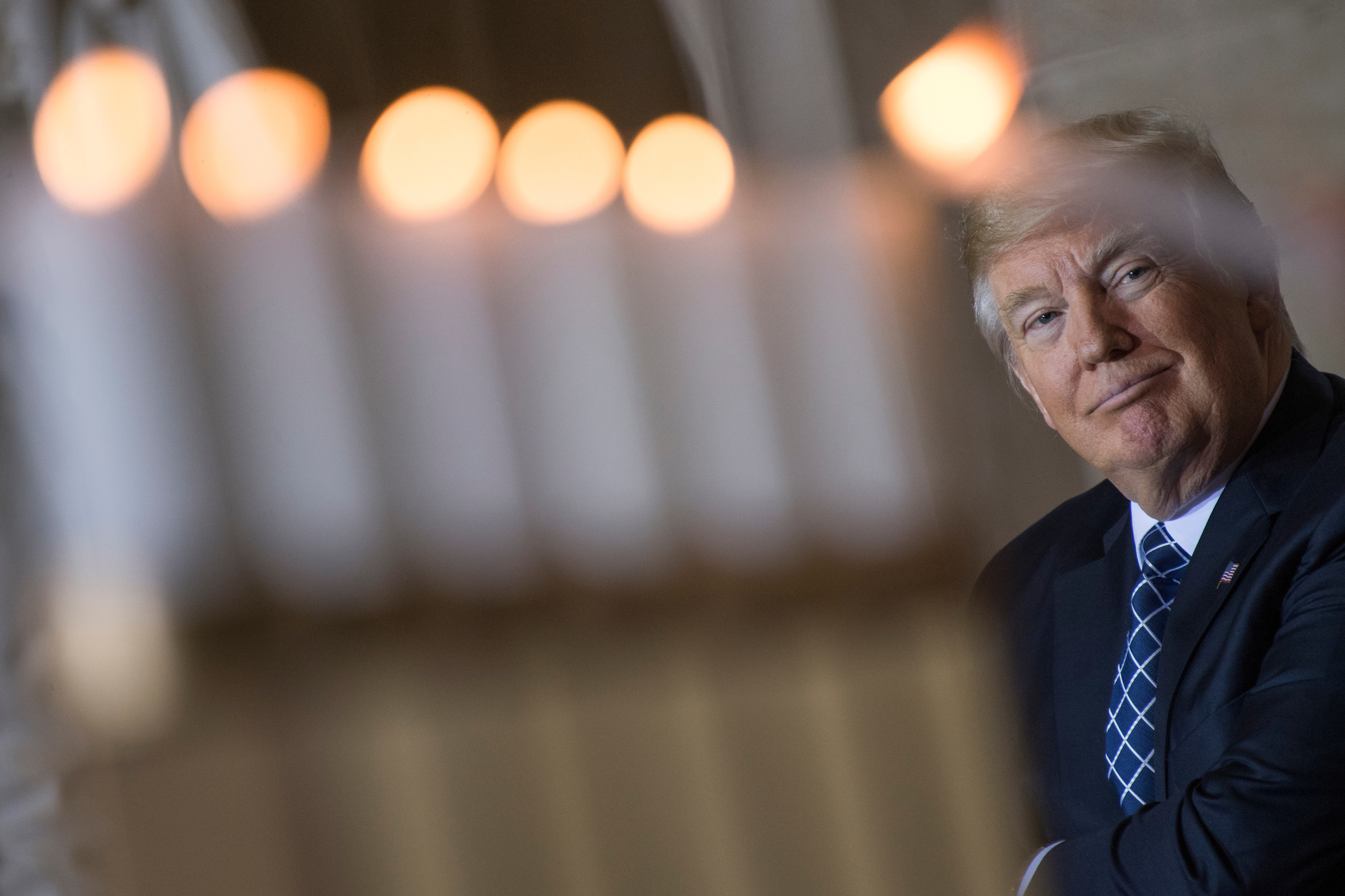 President Donald Trump watches the lighting of memorial candles during the annual Days of Remembrance Holocaust ceremony in the Capitol Rotunda on April 25, 2017. (Tom Williams/CQ Roll Call)