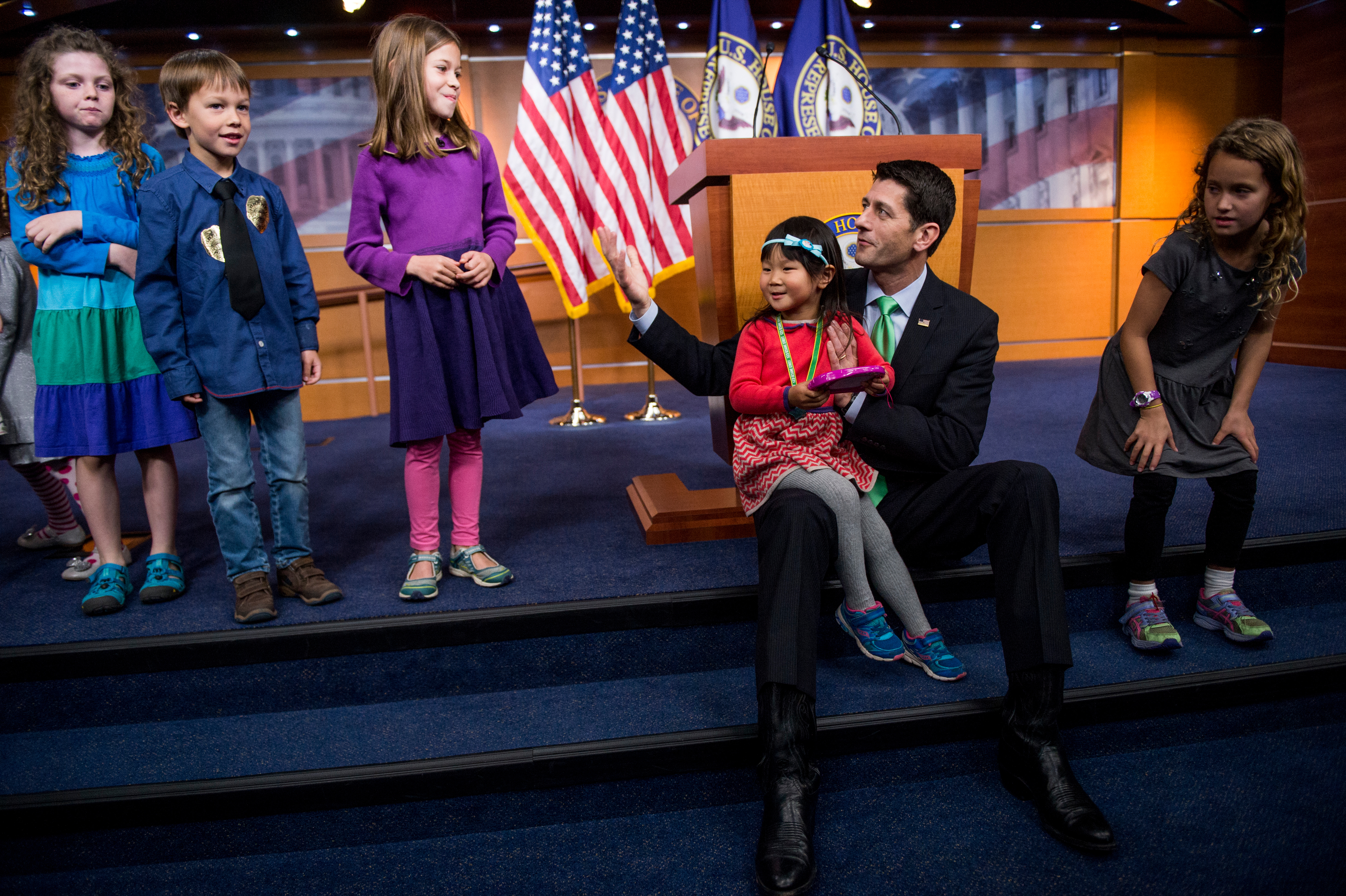 House Speaker Paul D. Ryan poses with children of members of the media on Take Our Daughters and Sons to Work Day in 2016. (Bill Clark/CQ Roll Call file photo)