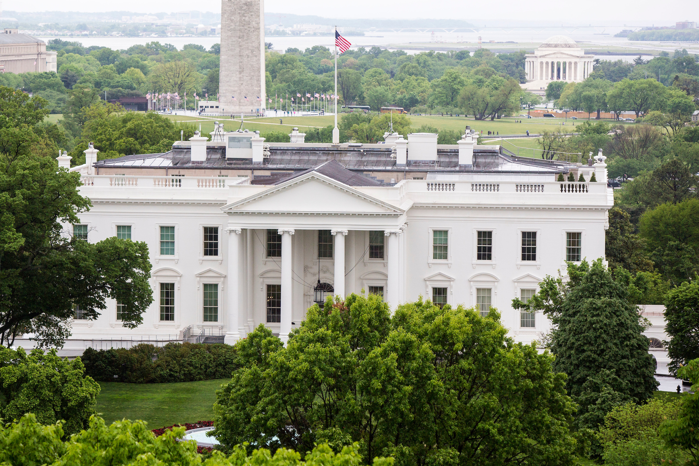 The North Lawn of the White House, the Washington Monument, and the Thomas Jefferson Memorial, seen from the roof of the Hay Adams Hotel. President Trump is nearing his 100th day in office. (Al Drago/CQ Roll Call)