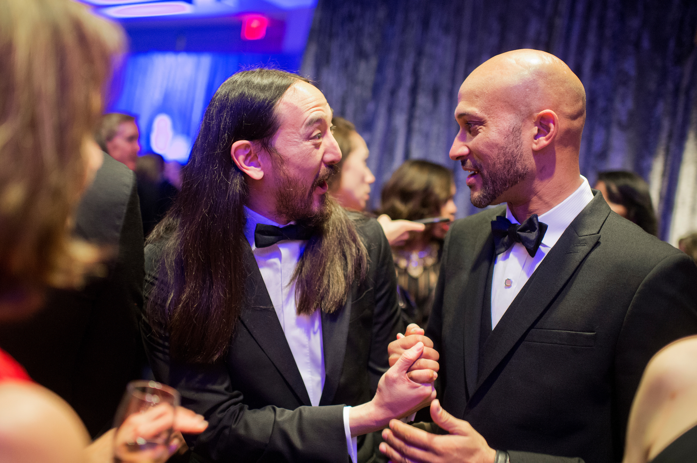 Music producer Steve Aoki, left, talks with actor Keegan Michael Key at the Yahoo/ABC News party in the Washington Hilton before the White House correspondents’ dinner on April 30, 2016. (Tom Williams/CQ Roll Call file photo)