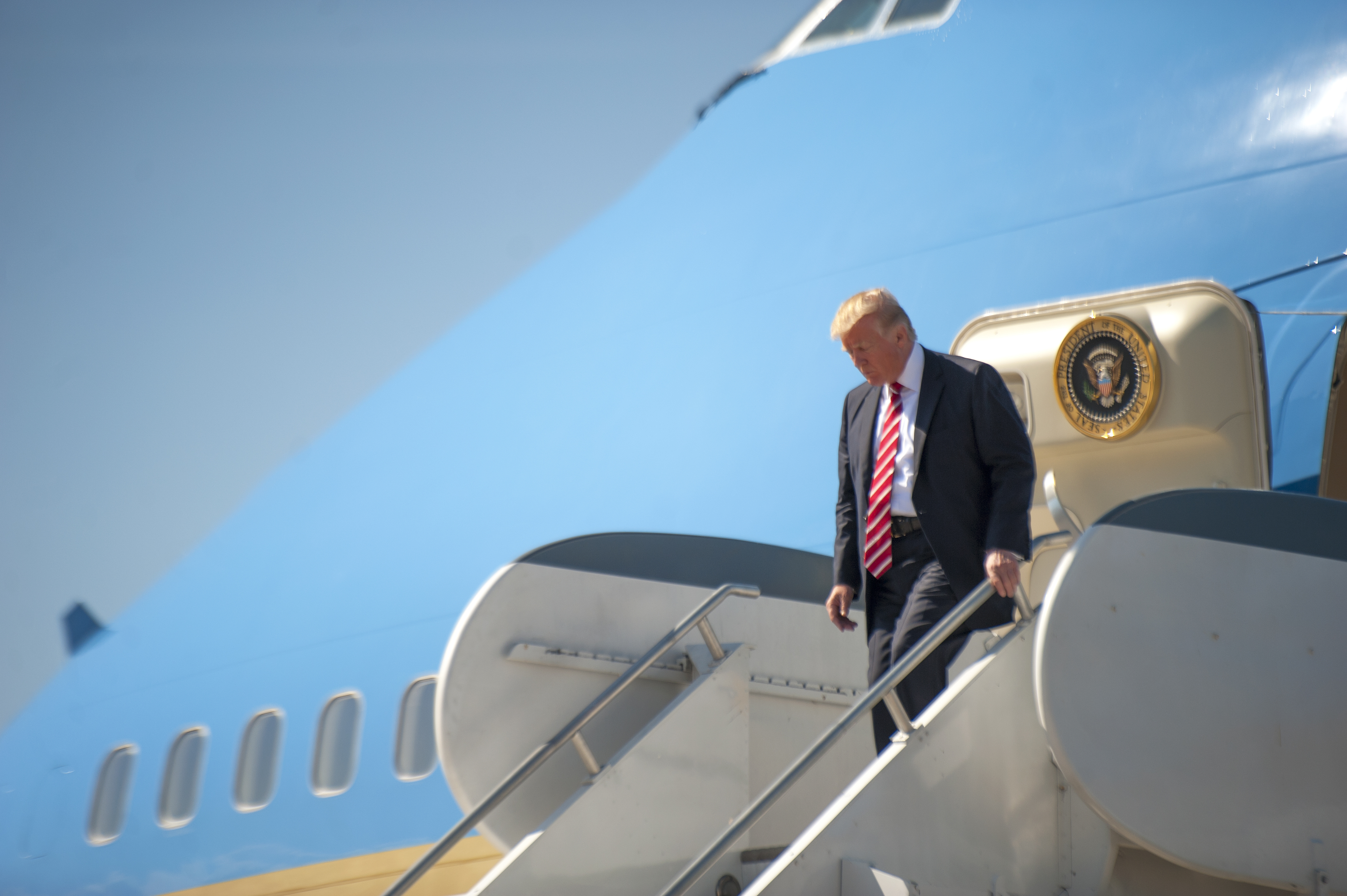 President Donald Trump exits Air Force One on Feb. 6 at MacDill Air Force Base, Fla. On Friday, he leaves on a five-country swing amid several domestic scandals. (U.S. Air Force photo by Staff Sgt. Ned T. Johnston via Wikimedia Commons)