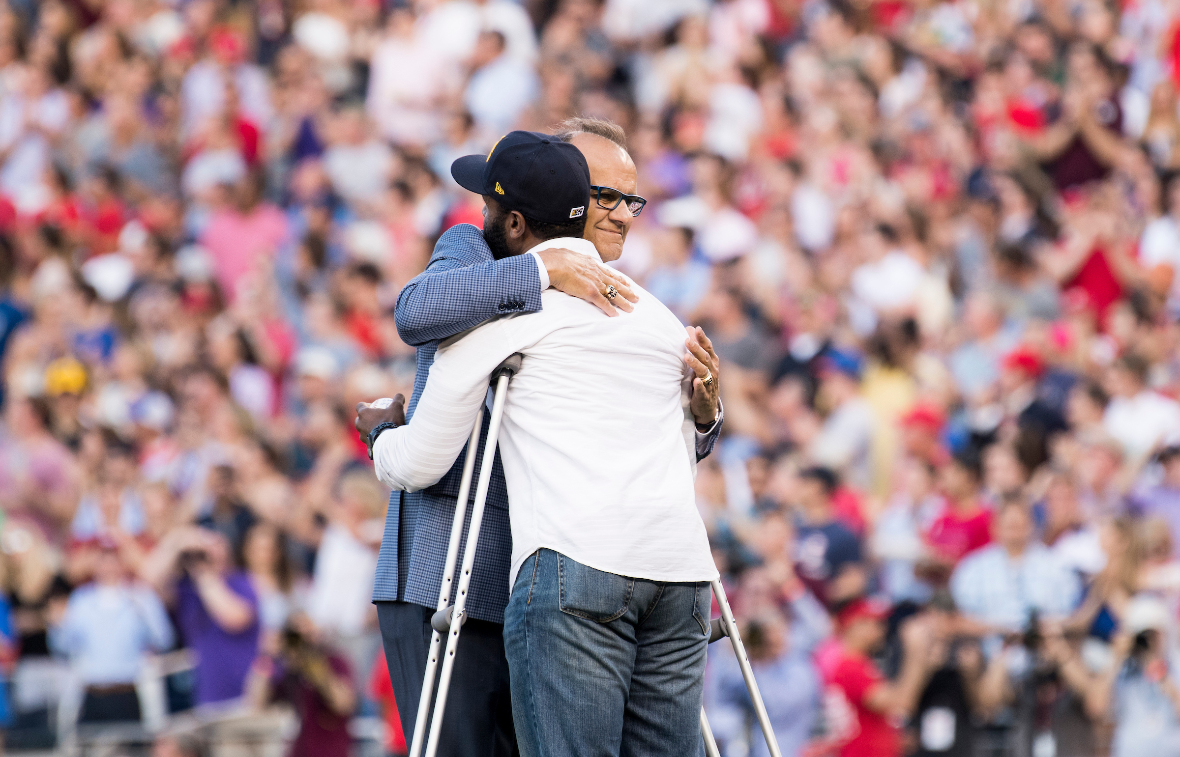 UNITED STATES - JUNE 15: Former New York Yankees manager Joe Torre gives a hug to David Bailey, one of the the injured Capitol Police officers on Rep. Steve Scalise's security detail, before Bailey threw out the first pitch at the annual Congressional Baseball Game at Nationals Park in Washington on Thursday, June 15, 2017. (Photo By Bill Clark/CQ Roll Call)