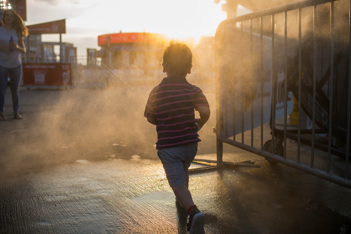 A child runs through a cool zone during the 56th Congressional Baseball Game. (Tom Williams/CQ Roll Call)