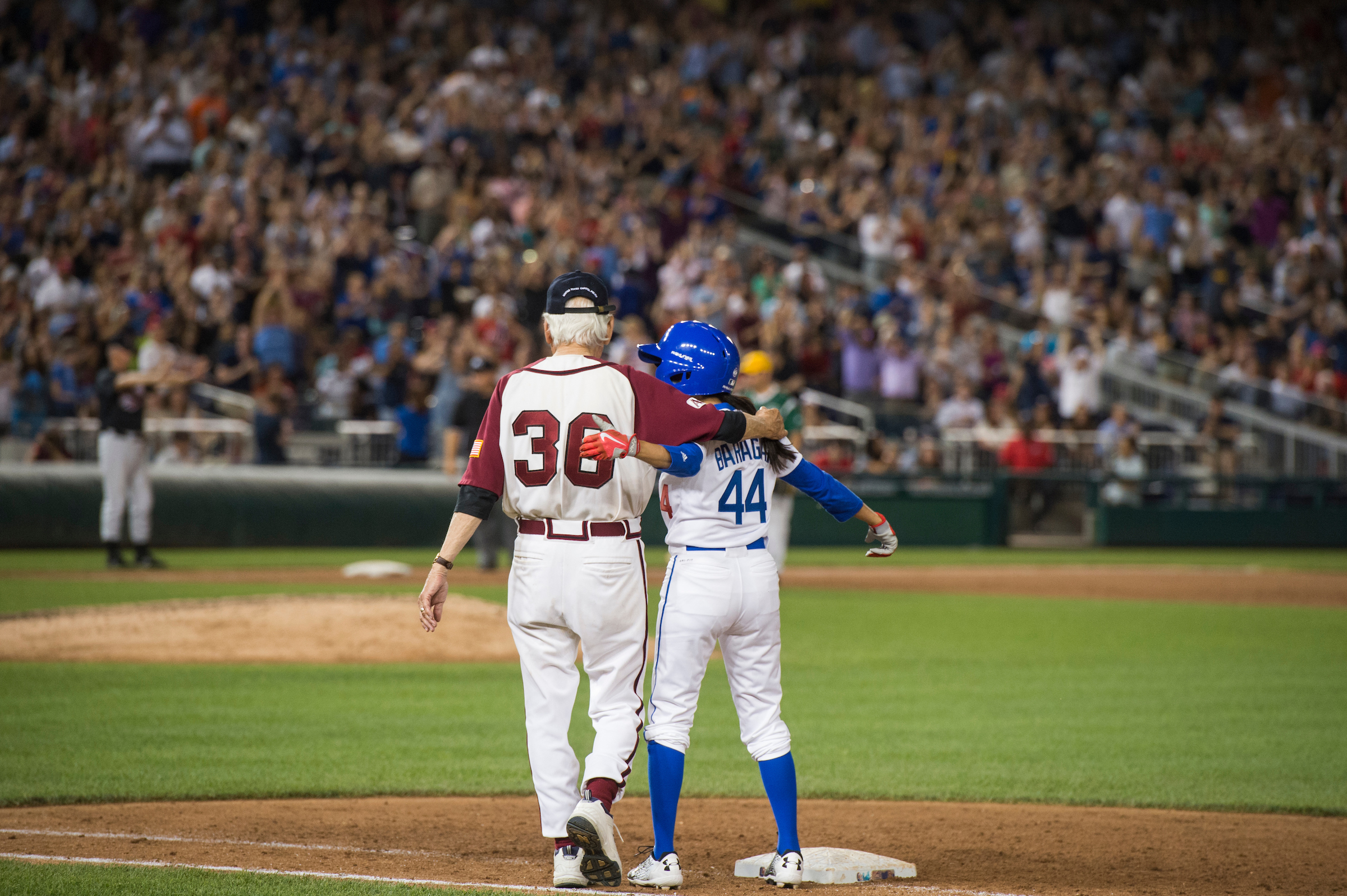 UNITED STATES - JUNE 15: Rep. Nanette Barragan, D-Calif., and Bill Pascrell, D-N.J., celebrate her hit during the 56th Congressional Baseball Game at Nationals Park on June 15, 2017. (Photo By Tom Williams/CQ Roll Call)