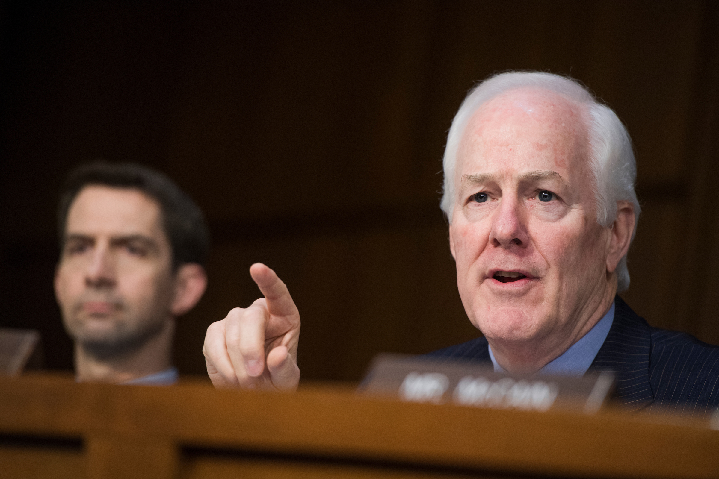 Sen. John Cornyn, R-Texas, right, says Medicaid is among the big outstanding issues for the health care talks. (Tom Williams/CQ Roll Call)