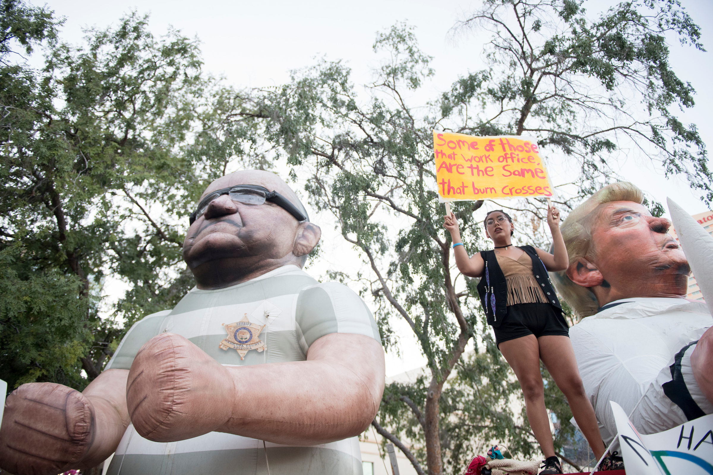 UNITED STATES - AUGUST 22: An inflatable depiction of Sheriff Joe Arpaio and President Donald Trump face protesters face the Phoenix Convention Center as protesters demonstrate against President Donald Trump during his rally at the convention center on Tuesday, Aug. 22, 2017. (Photo By Bill Clark/CQ Roll Call)