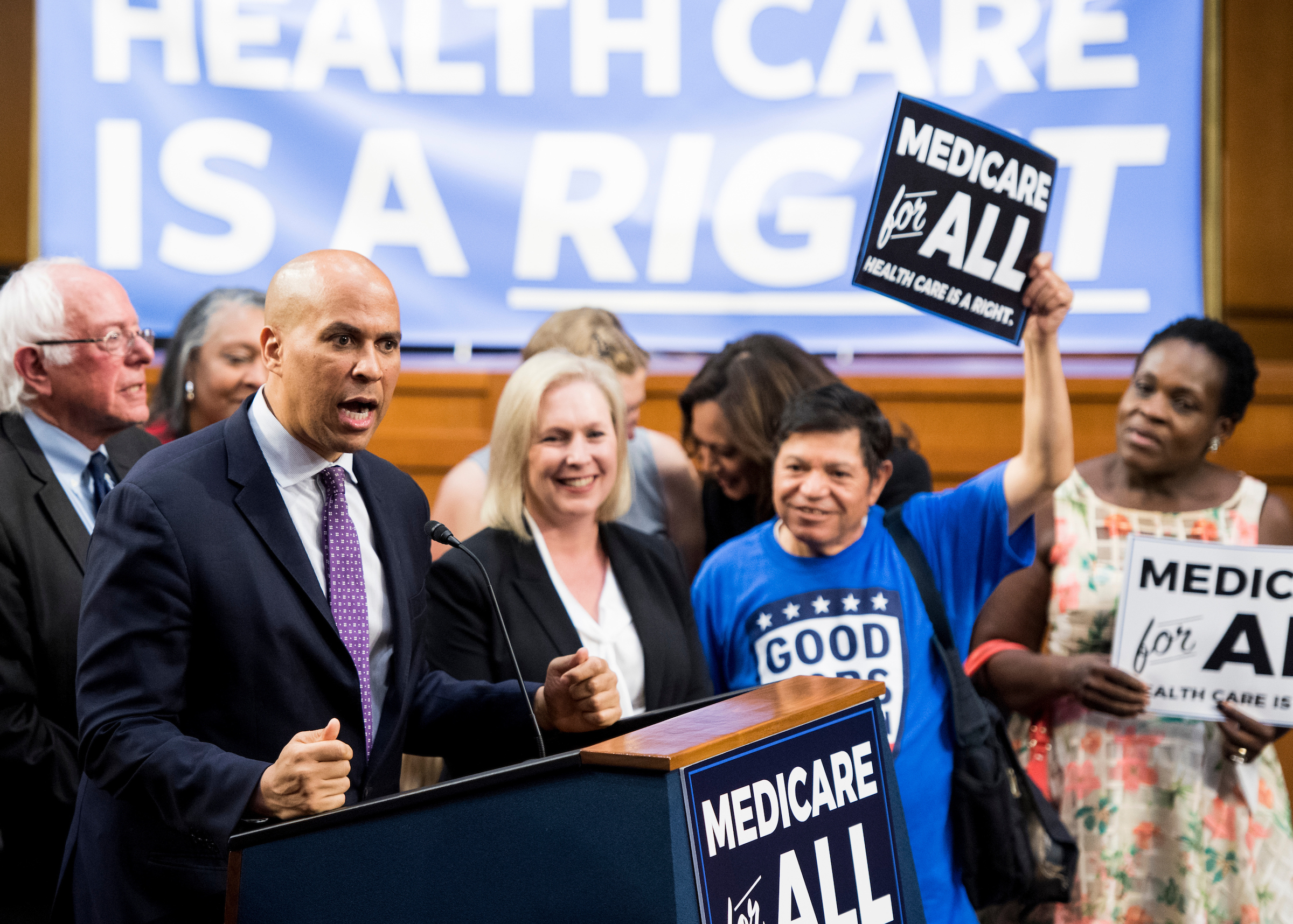 New Jersey Sen. Cory Booker speaks Wednesday during Vermont Sen. Bernie Sanders’ event to introduce the so-called Medicare for All Act of 2017. (Bill Clark/CQ Roll Call)