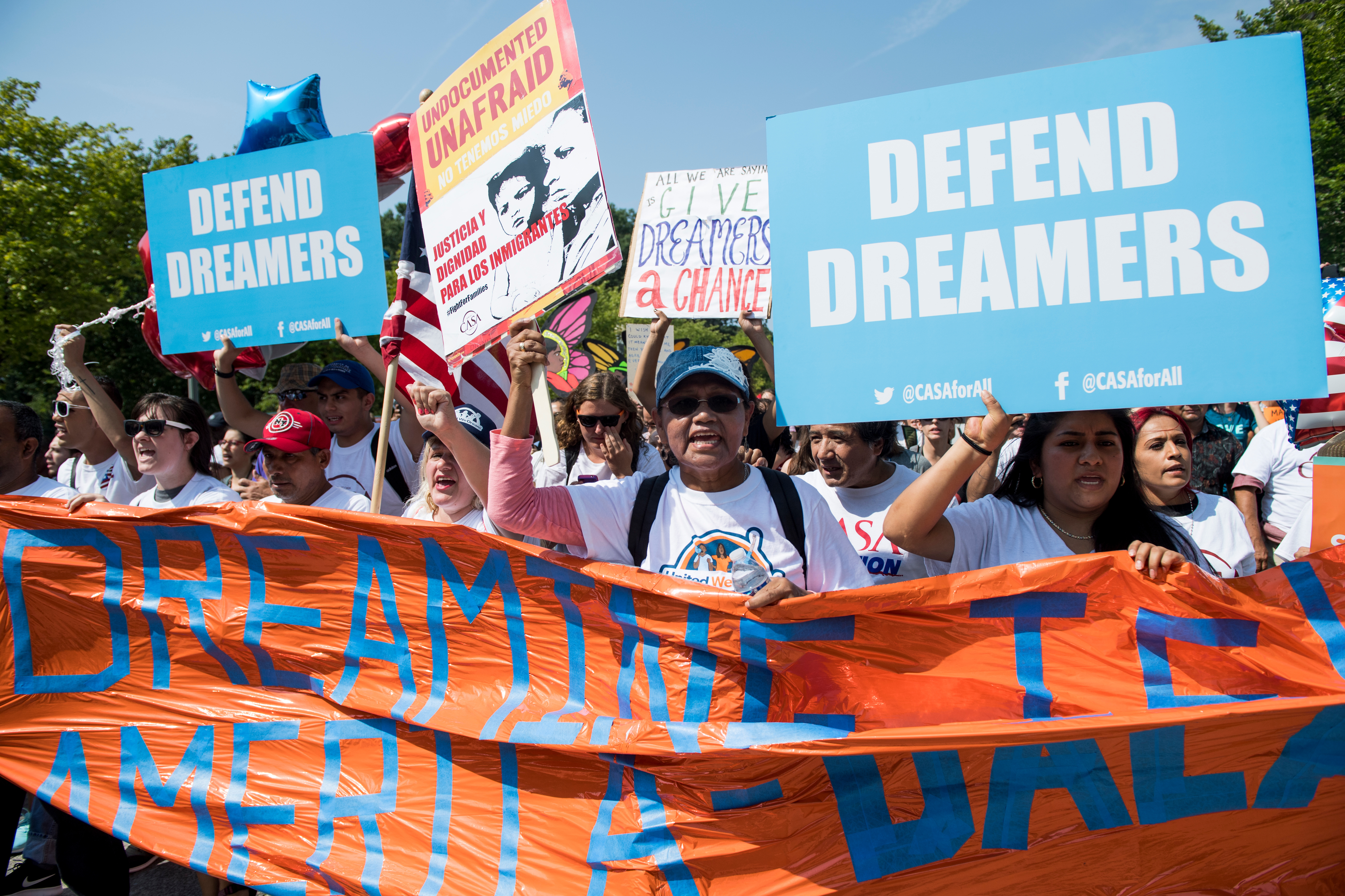 Immigration rights demonstrators prepare Tuesday to march from the White House to the Trump International Hotel and the Justice Department to oppose President Donald Trump's decision to end the DACA program for "Dreamers." (Bill Clark/CQ Roll Call)