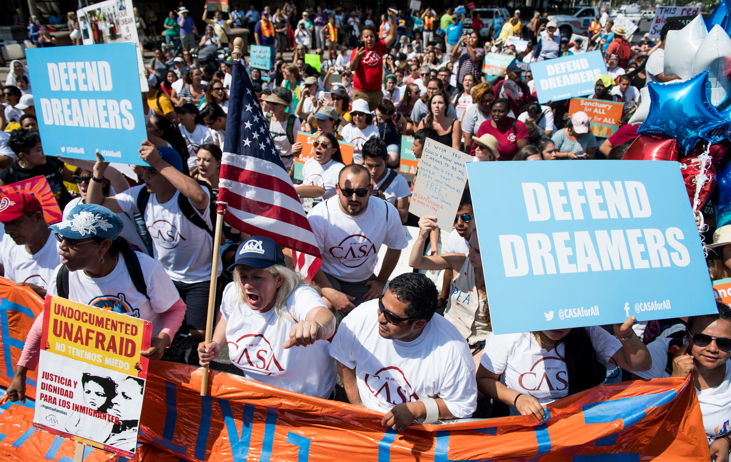 Immigration rights demonstrators prepare to march from the White House to the Trump Hotel and the Justice Department to oppose President Trump's decision to end the DACA program for “dreamers” on Tuesday, Sept. 5, 2017. (Bill Clark/CQ Roll Call)