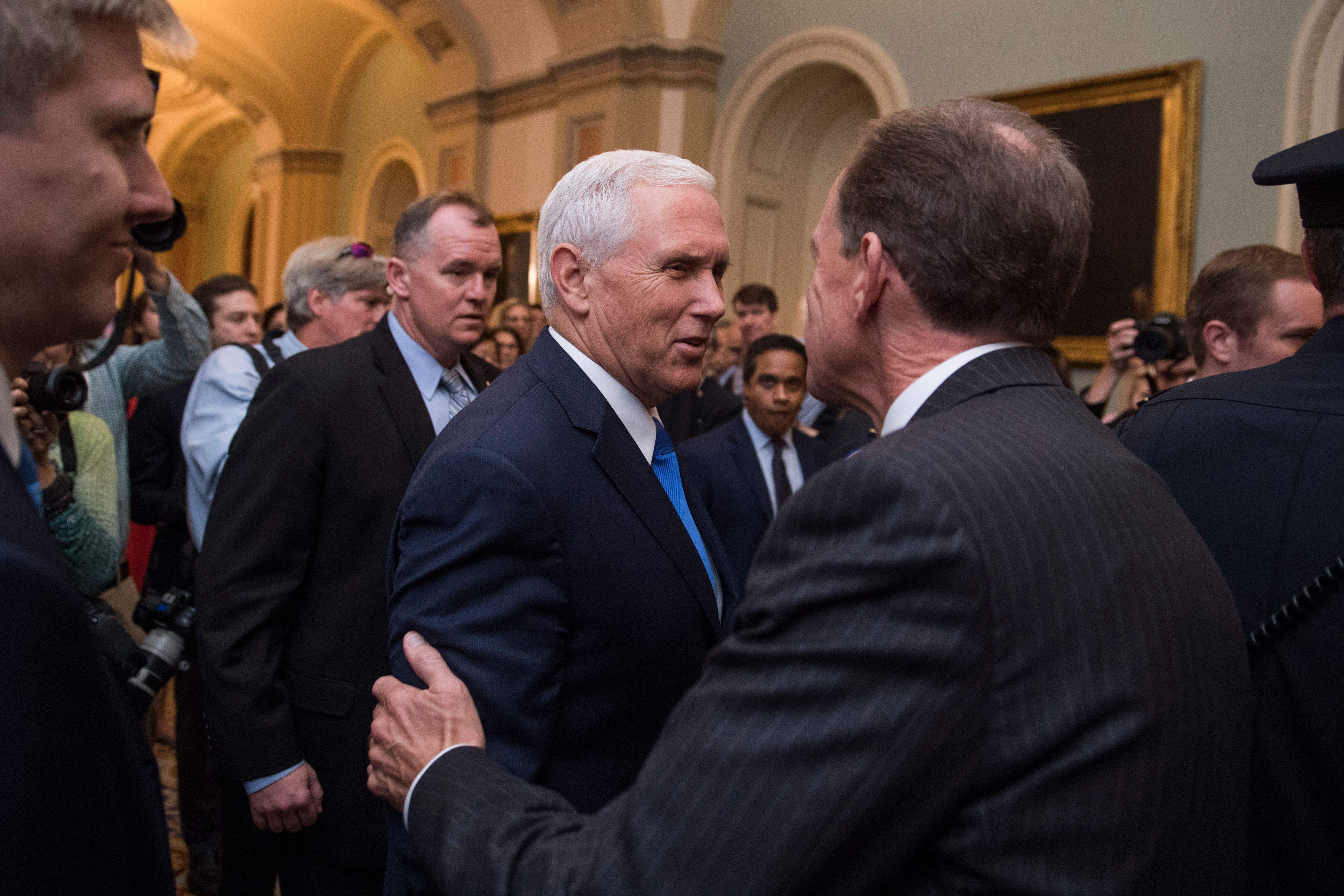 Vice President Mike Pence and Pennsylvania GOP Sen. Patrick J. Toomey talk in the Capitol before the Senate Policy luncheons on Sept. 19. Pence has not been able to help secure 50 Republican votes on a health care overhaul bill this year. But GOP lawmakers don’t blame him. (Tom Williams/CQ Roll Call)