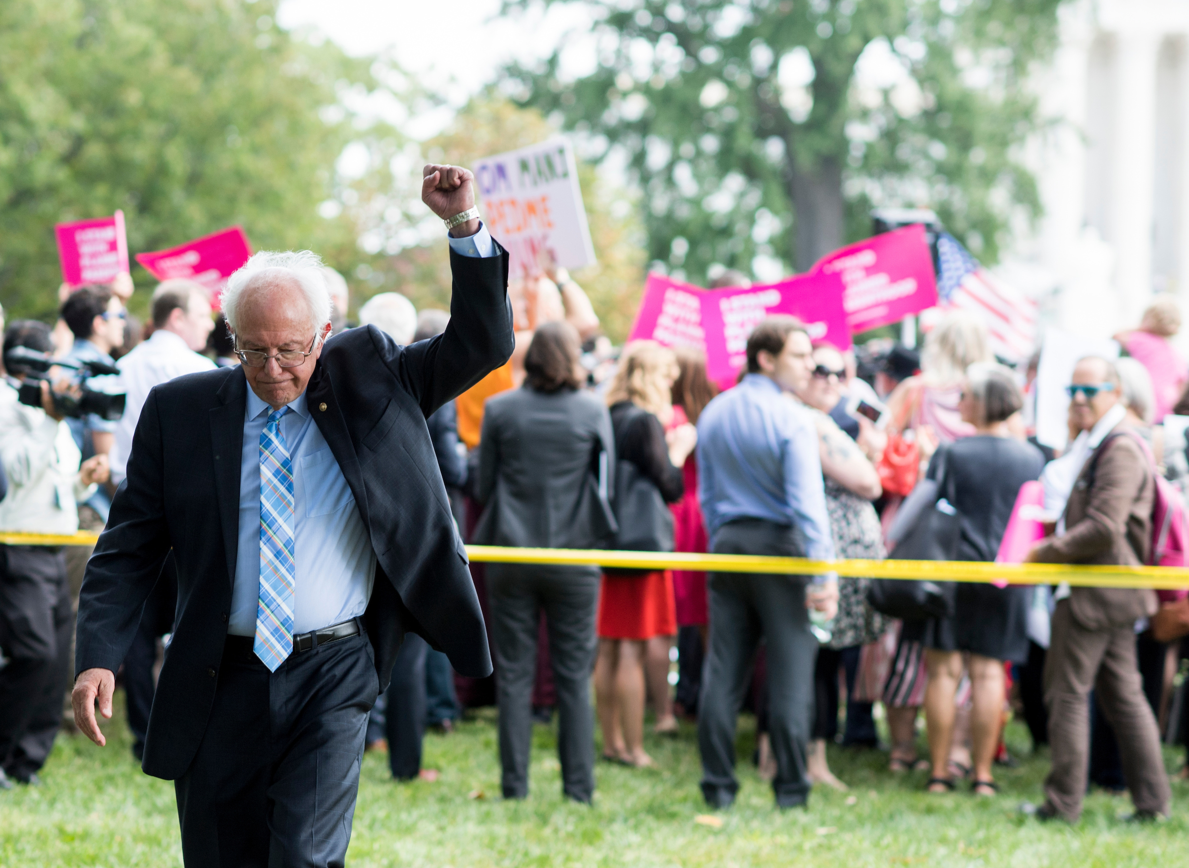 UNITED STATES - SEPTEMBER 19: Sen. Bernie Sanders, I-Vt., raises his fist as rally attendees chant 