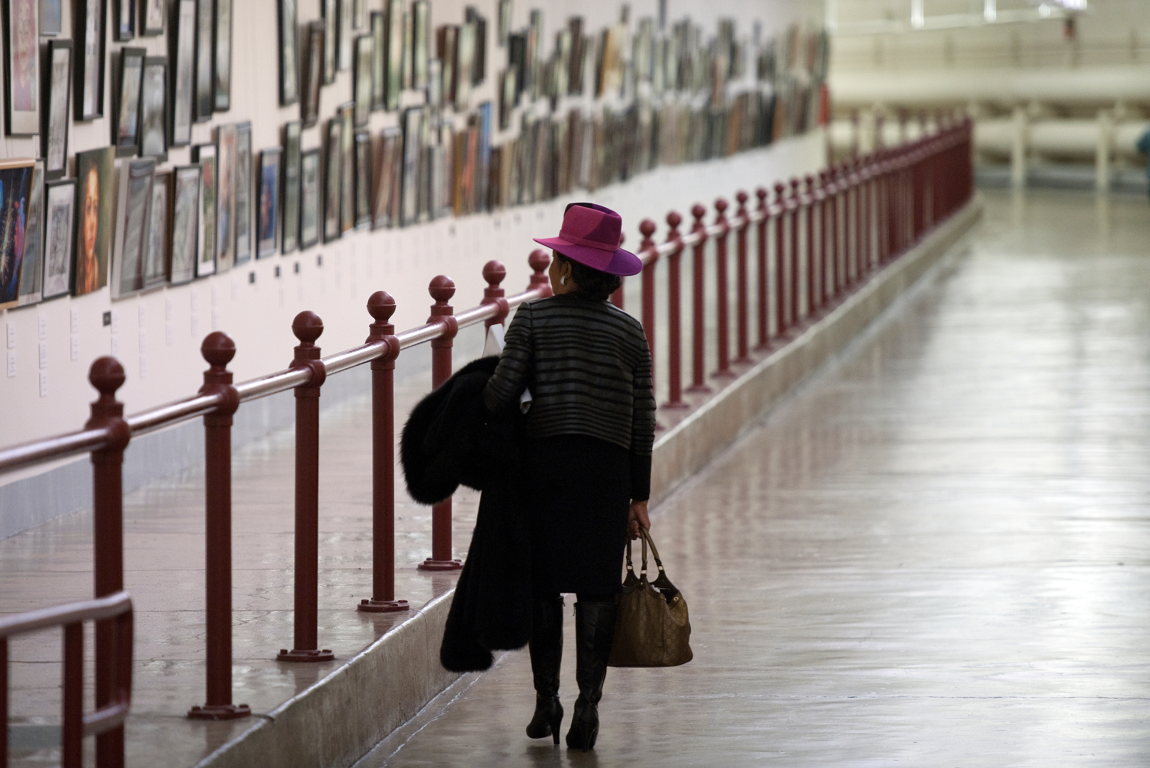 Rep. Frederica Wilson, D-Fla., admires the high school projects hanging in the Cannon House Office Building tunnel as she makes her way from the Capitol. (Douglas Graham/CQ Roll Call file photo)