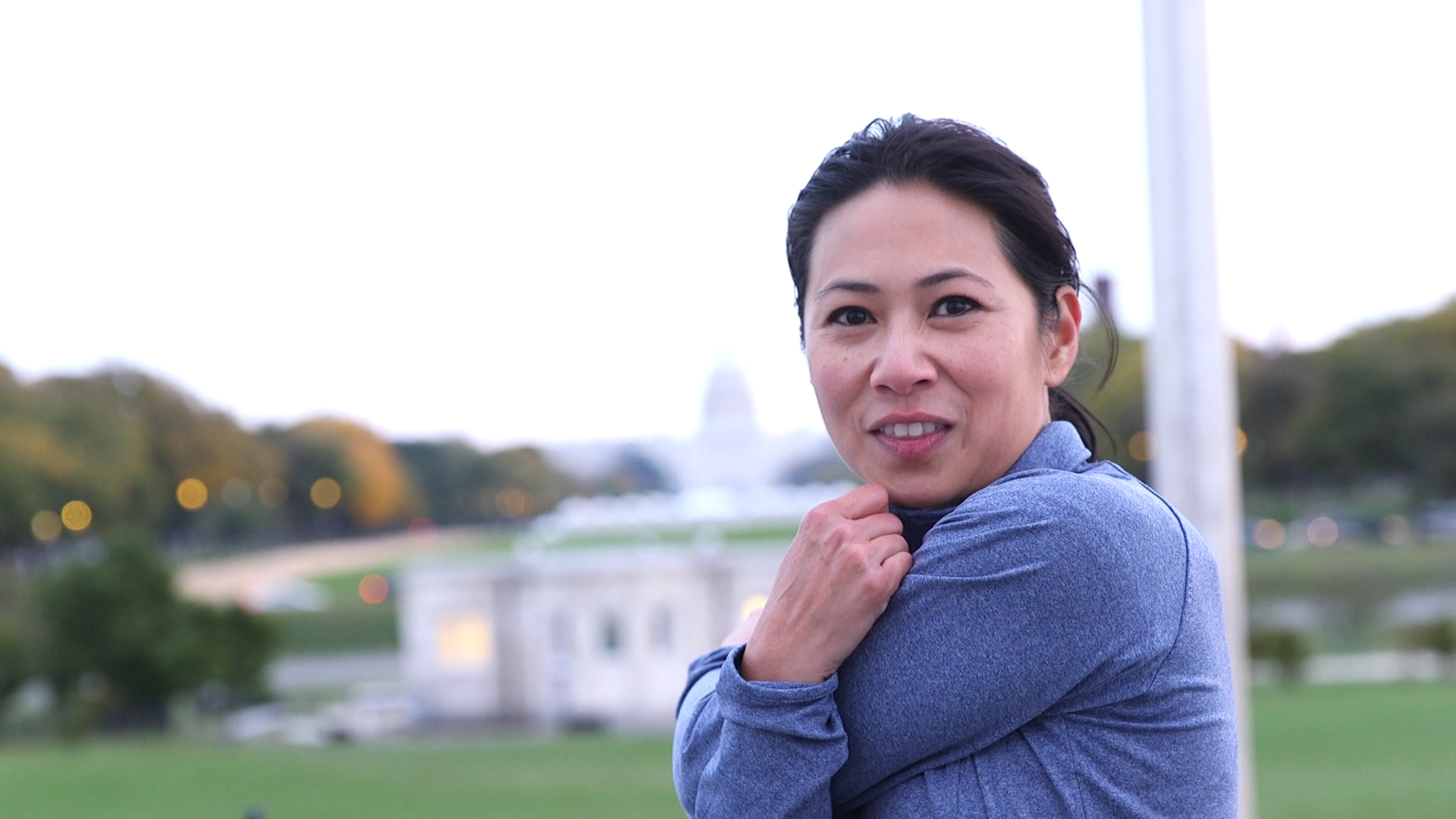 Murphy stretches during her morning run, with the Capitol in the background. (Bian Elkhatib/CQ Roll Call)