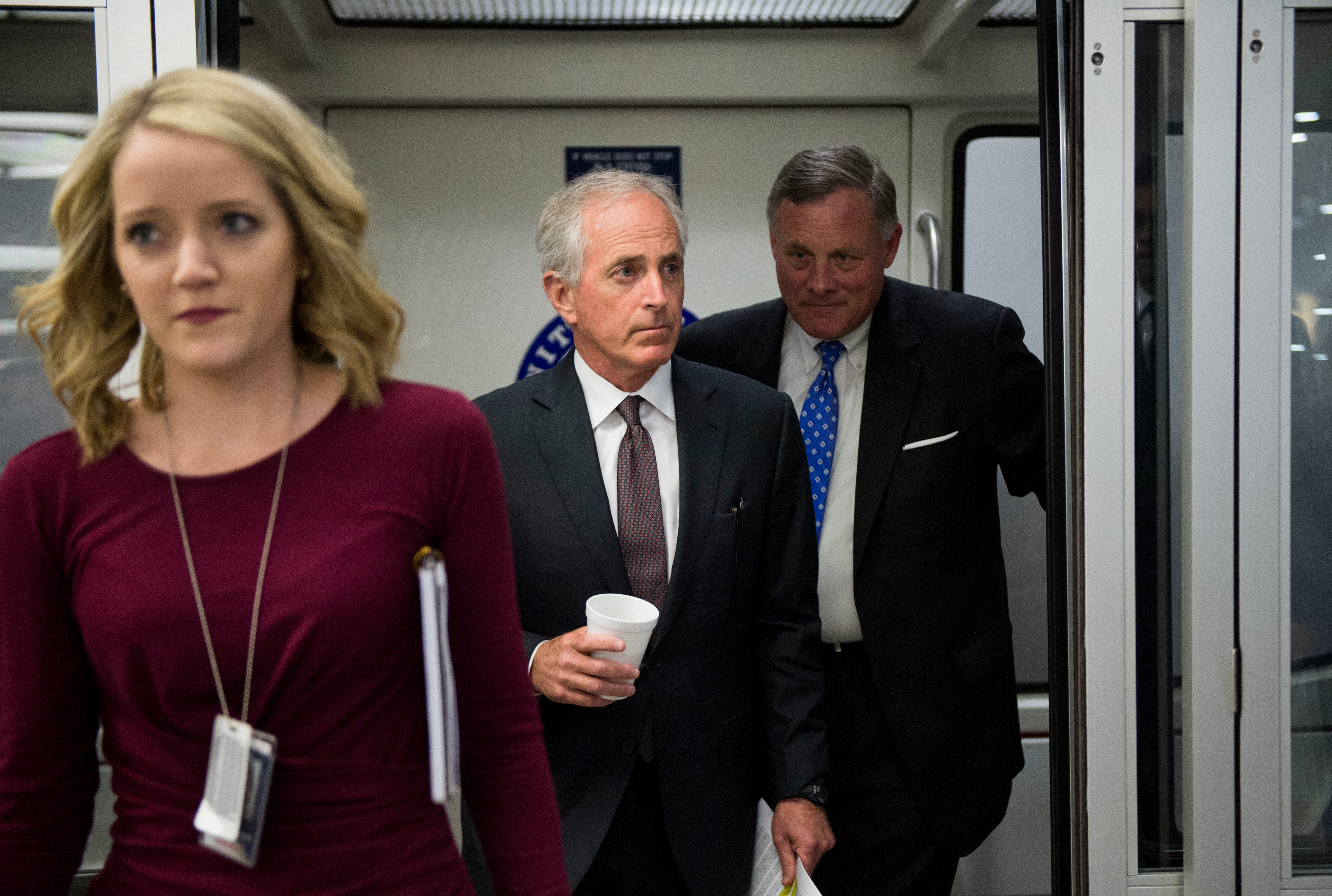 Micah Johnson walks with her boss Tennessee Sen. Bob Corker, center, as they get off the Senate subway in May 2016. Also pictured, North Carolina Sen. Richard M. Burr. (Bill Clark/CQ Roll Call file photo)