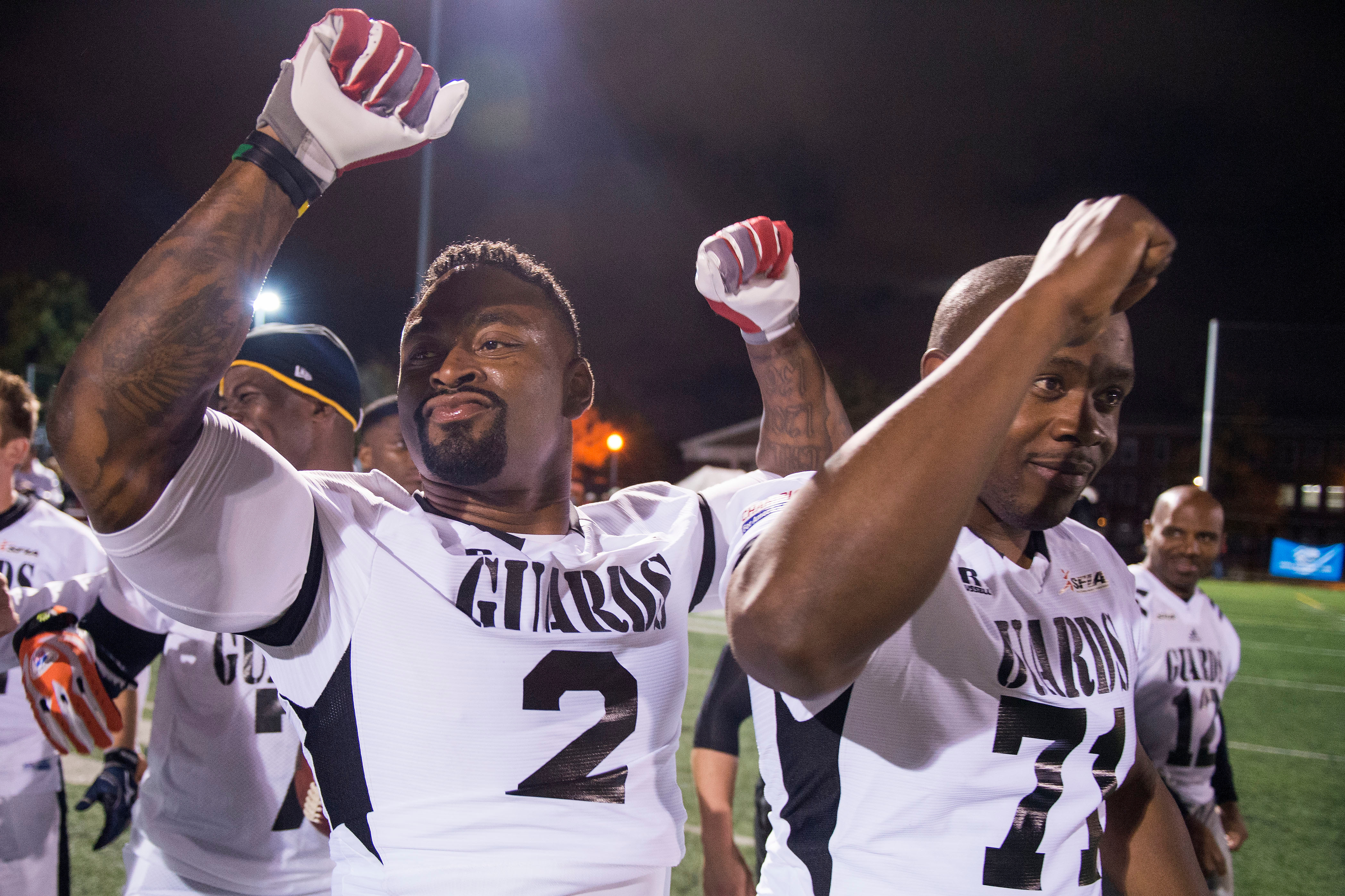 The Guards’ Larry Bell, left, and Travis Wells celebrate The Guards’ victory after the eighth annual Congressional Football Game for Charity in 2015. Tickets to this year’s game are $10. (Al Drago/Roll Call File Photo)