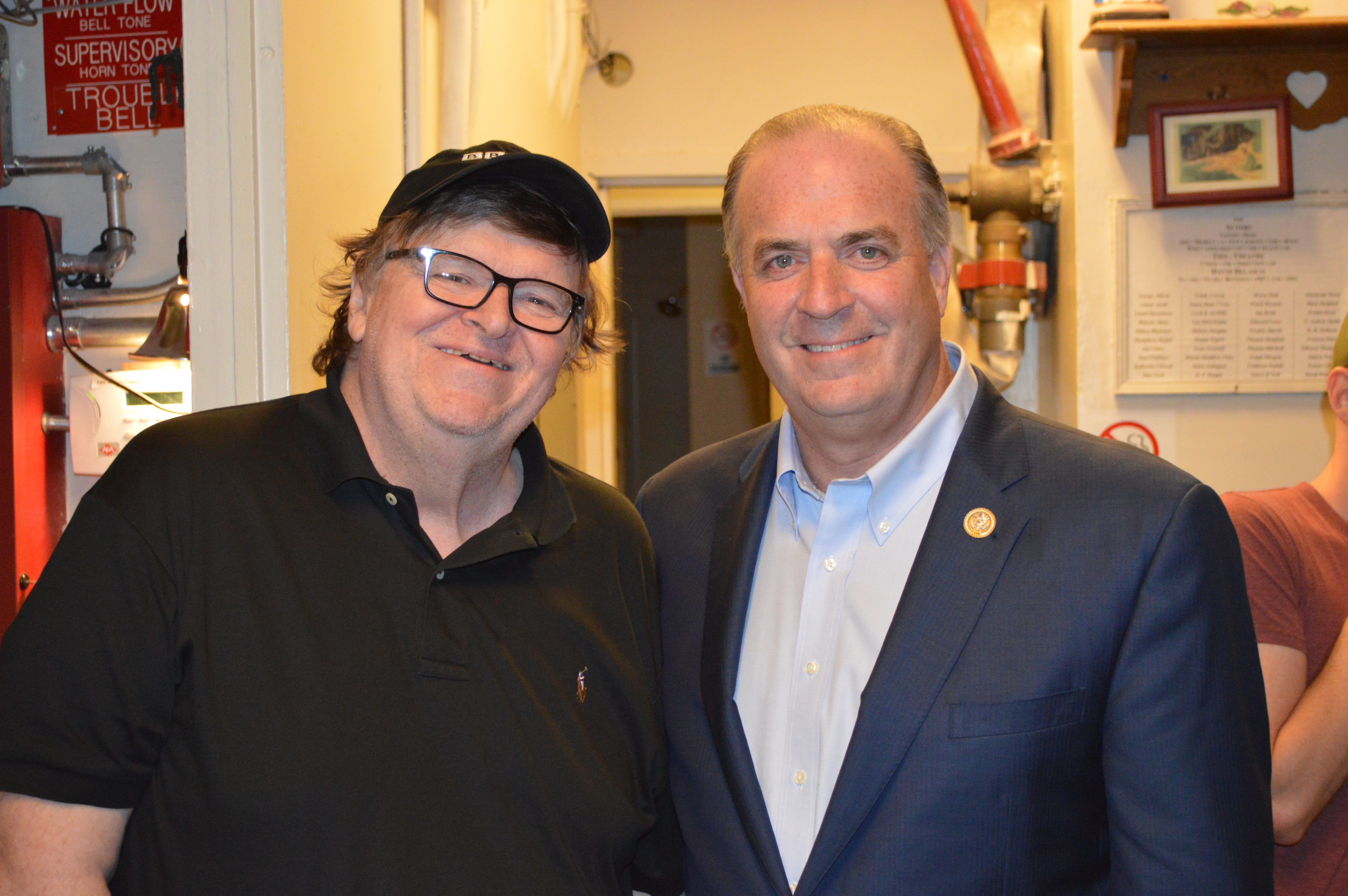 Michigan Rep. Dan Kildee, right, with filmmaker Michael Moore backstage at Broadway’s Belasco Theatre on Sunday. The two have known each other since high school. (Courtesy Kildee’s office)