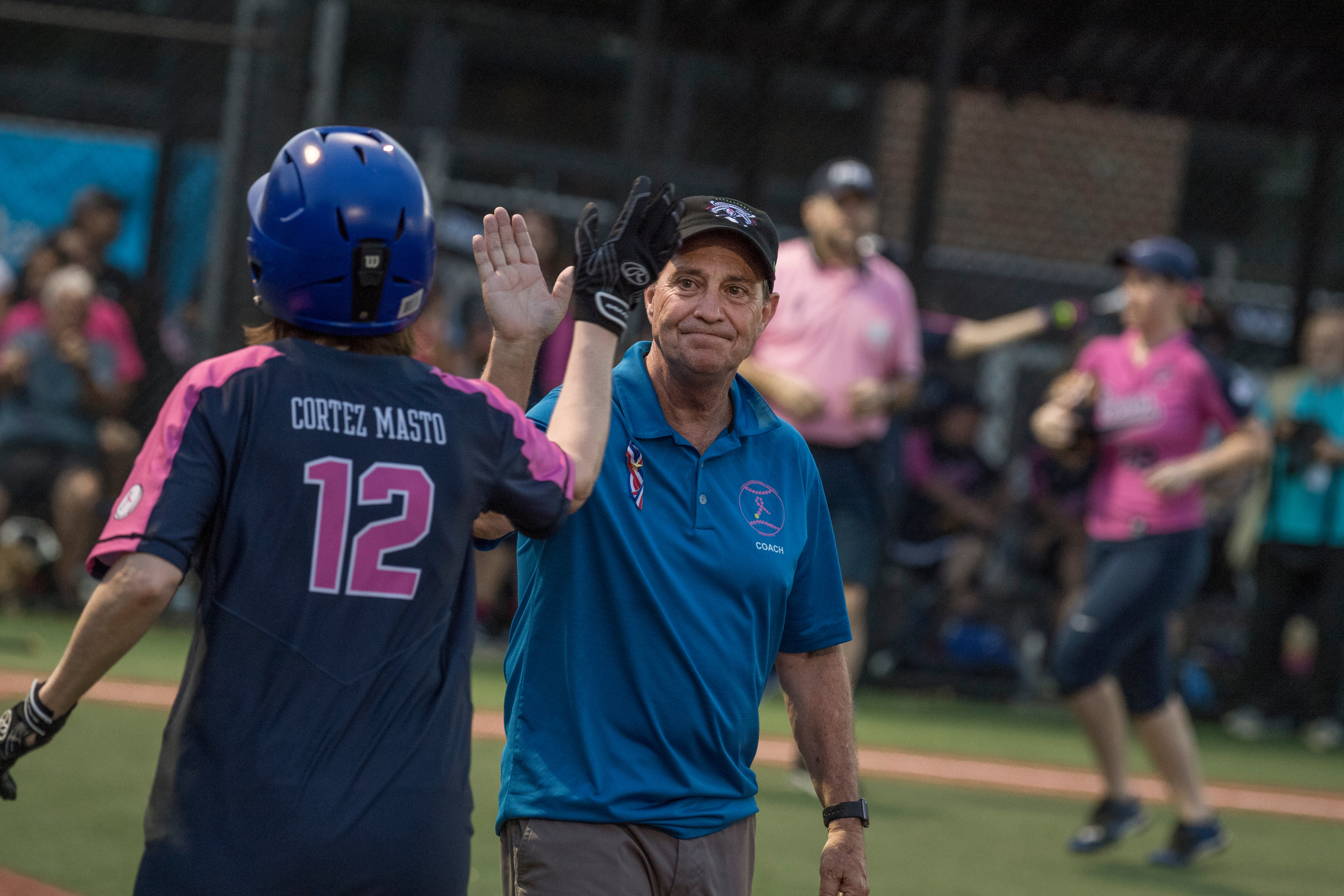 UNITED STATES - JUNE 21: Team Congress coach Rep. Ed Perlmutter, D-Colo., greets Sen. Catherine Cortez Masto, D-Nev., during the Congressional Women's Softball game that pits Congresswomen against female journalists at Watkins Recreation Center on Capitol Hill, June 21, 2017. The game benefits the Young Survival Coalition that helps young women with breast cancer. The press team prevailed 2-1. (Photo By Tom Williams/CQ Roll Call)