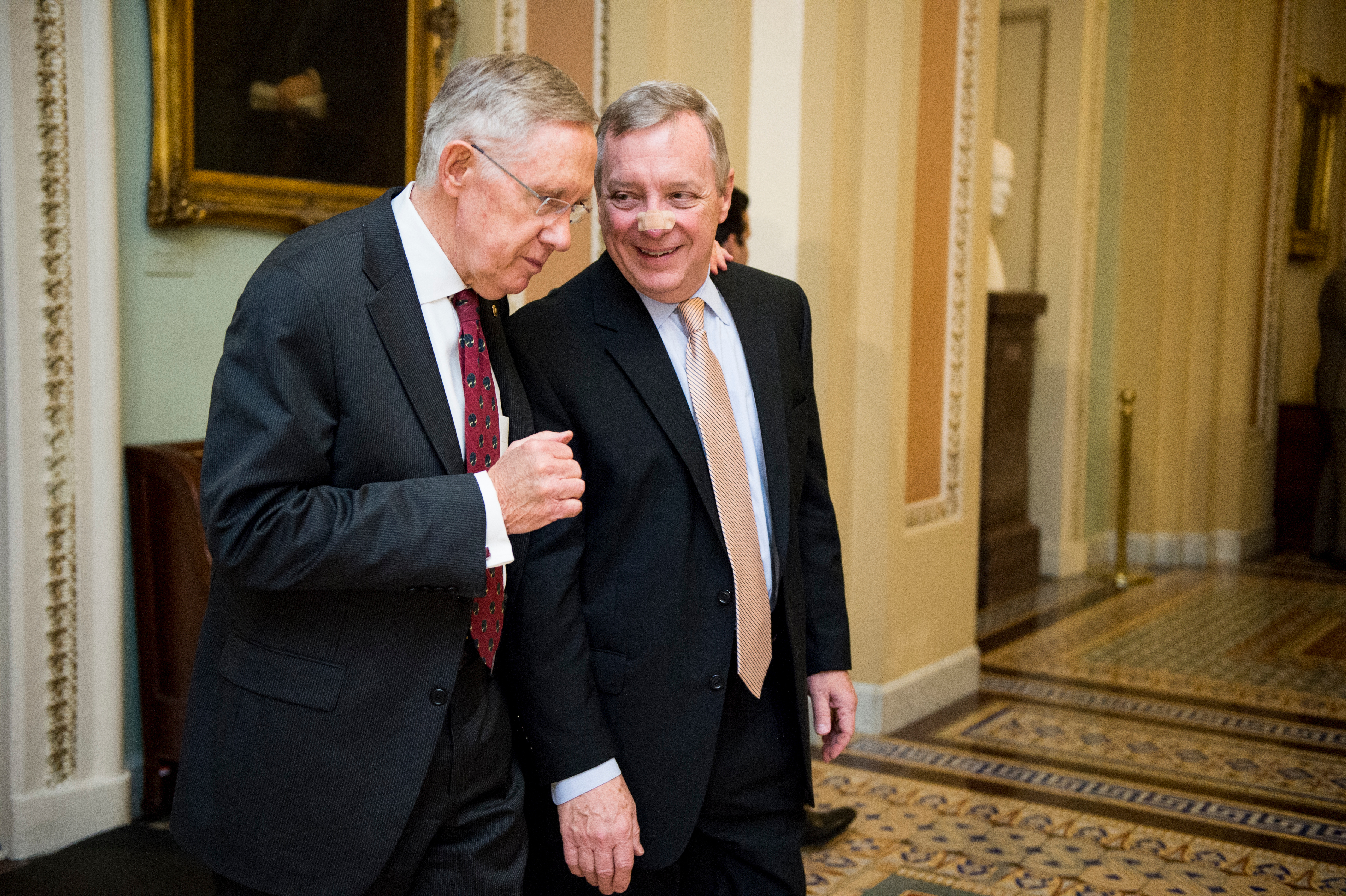UNITED STATES - APRIL 29: Senate Majority Leader Harry Reid, D-Nev., and Sen. Dick Durbin, D-Ill., talk as they walk to the Senate Democrats' policy lunch on Tuesday, April 29, 2014. (Photo By Bill Clark/CQ Roll Call)