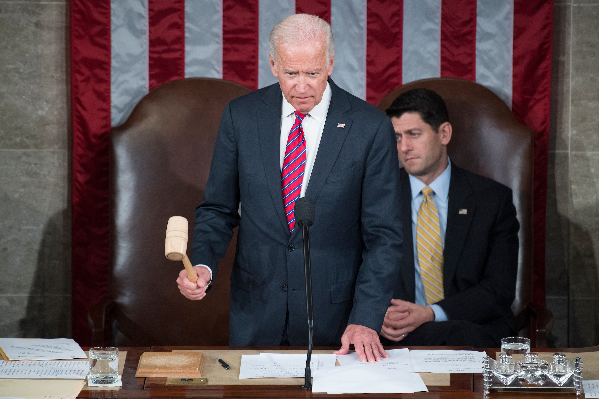 Former Vice President Joseph R. Biden Jr. and Speaker Paul D. Ryan, R-Wis., conduct a count of the Electoral College votes during a joint session of Congress in the House chamber in January. (Tom Williams/CQ Roll Call file photo)