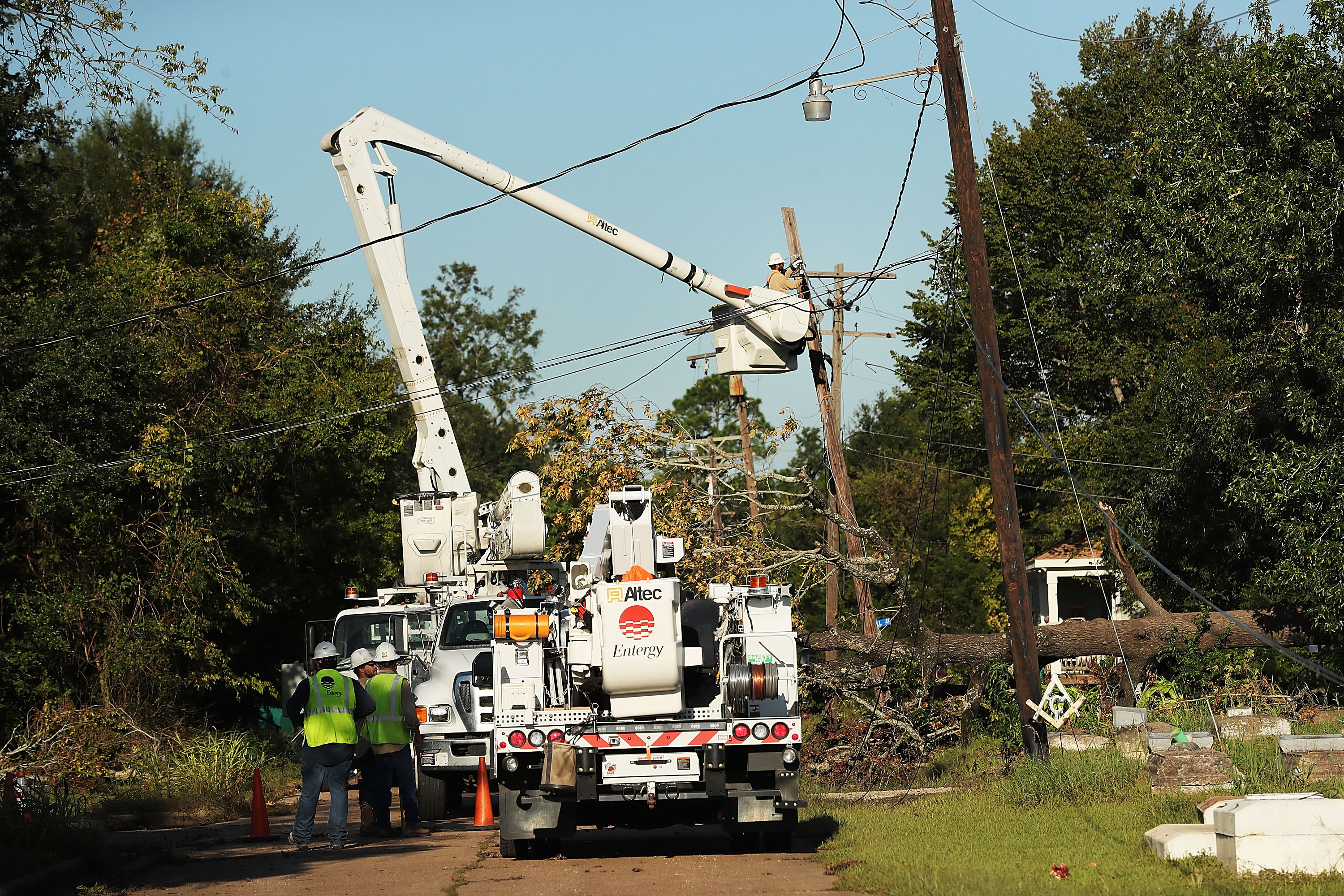 ORANGE, TX - SEPTEMBER 07: Electrical workers restore wires in Orange as Texas slowly moves toward recovery from the devastation of Hurricane Harvey on September 7, 2017 in Orange, Texas. Almost a week after Hurricane Harvey ravaged parts of the state, some neighborhoods still remained flooded and without electricity. While downtown Houston is returning to business, thousands continue to live in shelters, hotels and other accommodations as they contemplate their future. (Photo by Spencer Platt/Getty Images)