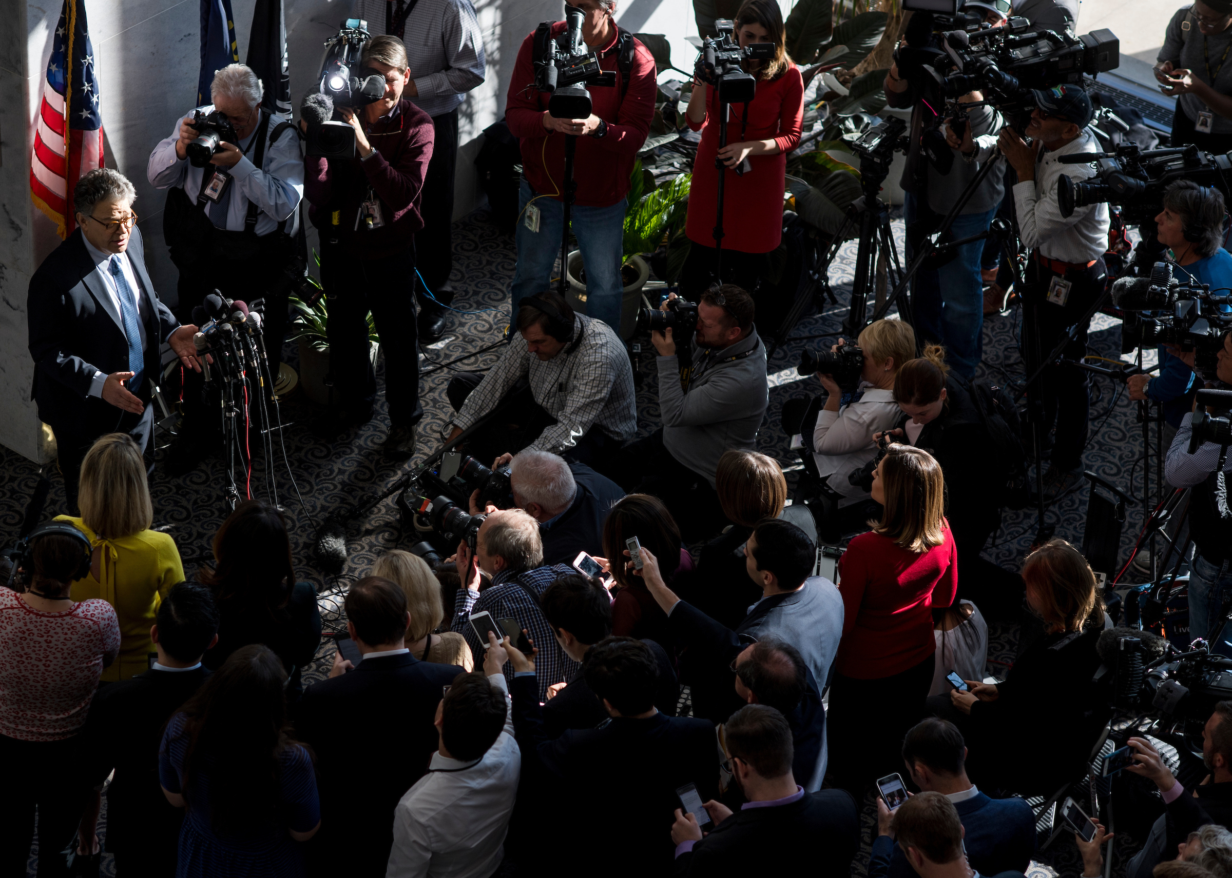 Minnesota Sen. Al Franken speaks to reporters Monday outside his office in the Hart Building on Monday. (Bill Clark/CQ Roll Call)