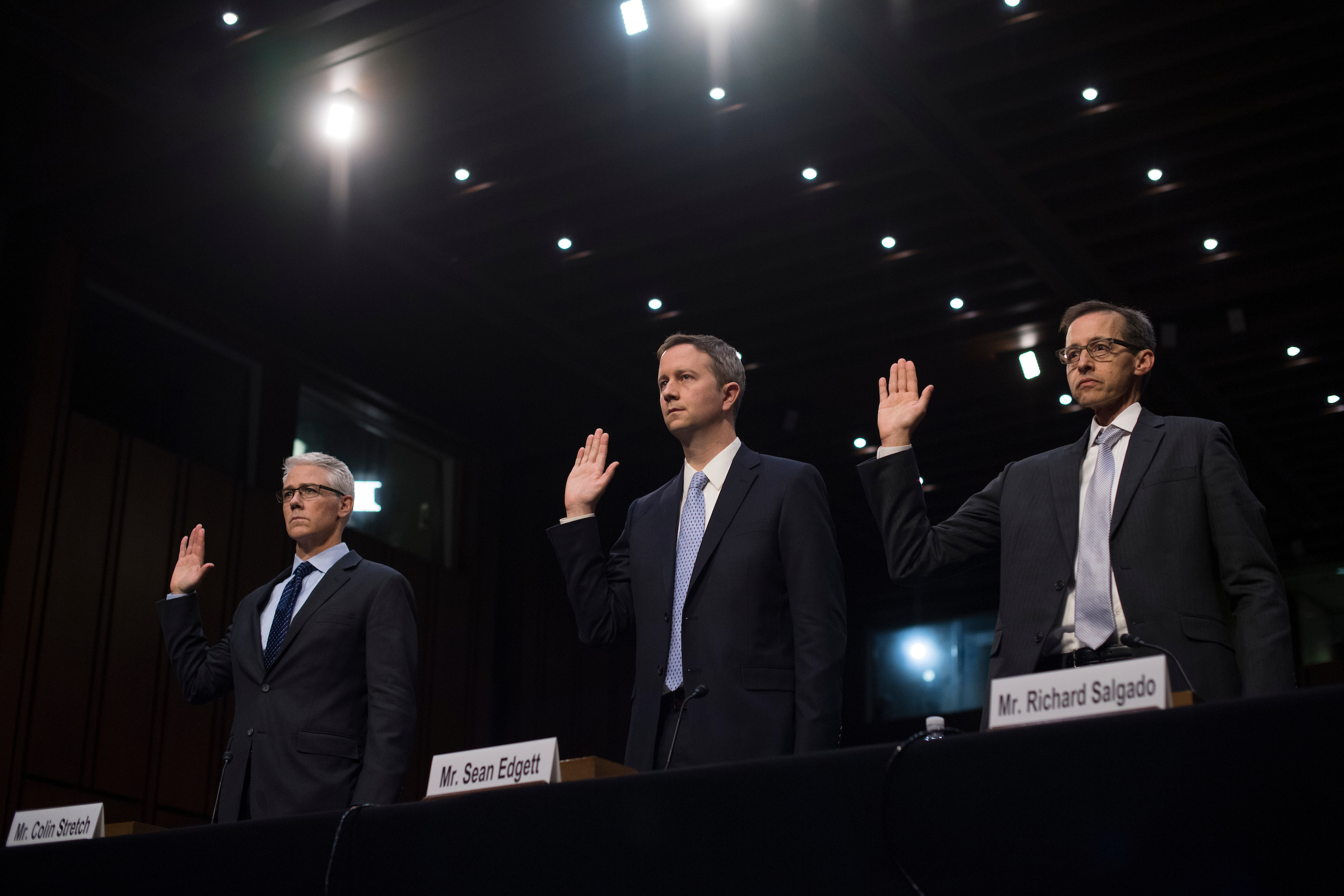 UNITED STATES - OCTOBER 31: From left, Colin Stretch, general counsel for Facebook, Sean Edgett, acting general counsel at Twitter, and Richard Salgado, director for information security and law enforcement matters at Google, are sworn into a Senate Judiciary Crime and Terrorism Subcommittee hearing in Hart Building titled