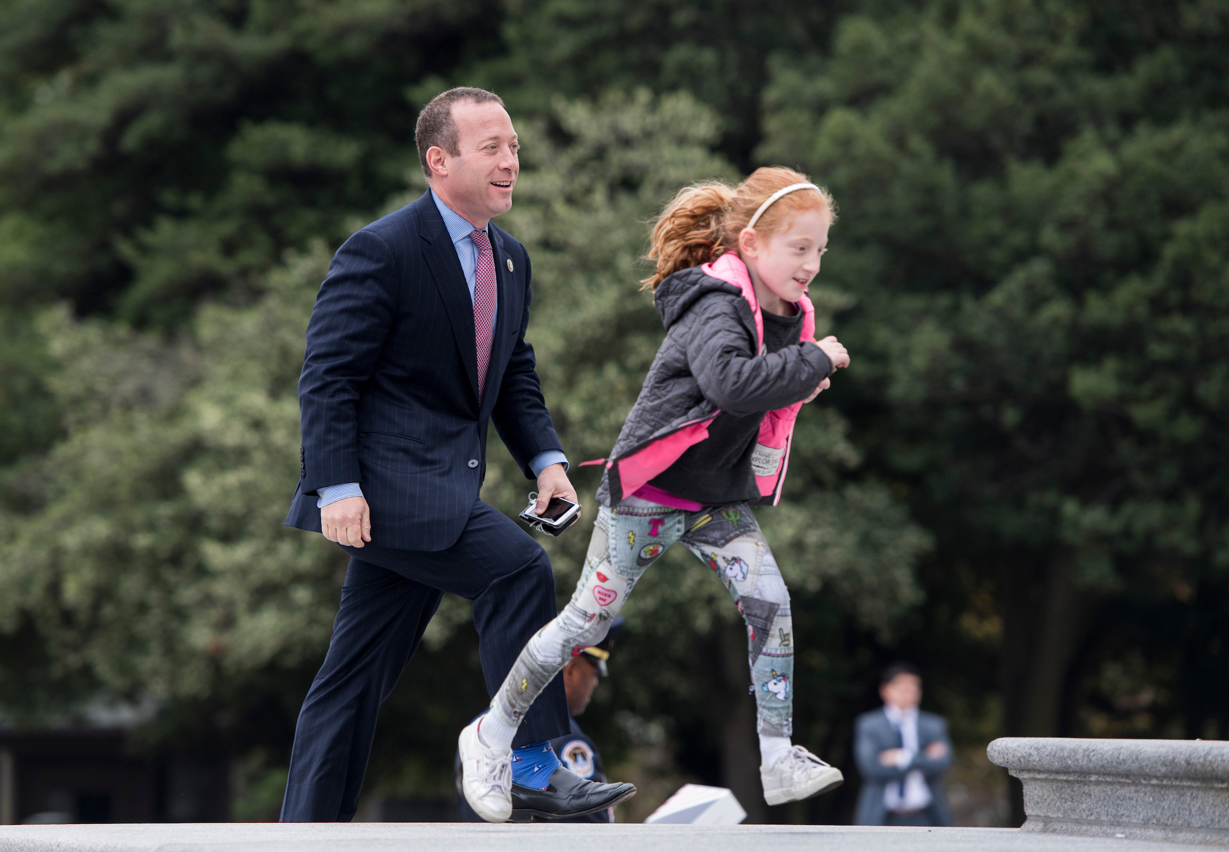 Rep. Josh Gottheimer, D-N.J., walks up the House steps with his daughter Ellie for a vote in the Capitol on Thursday, Nov. 9, 2017. (Bill Clark/CQ Roll Call file photo)