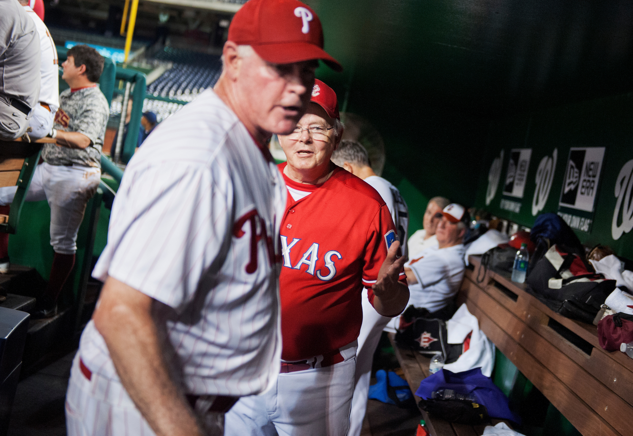 Coach Joe Barton, R-Texas, tries to calm down Rep. Patrick Meehan, R-Pa., in the Republican dugout after Meehan was pulled from the mound during the 53rd Congressional Baseball Game from the Republican team dugout in Nationals Park, June 25, 2014. The Democrats prevailed over the Republicans 15-6 in a rain shortened game. (Tom Williams/CQ Roll Call)