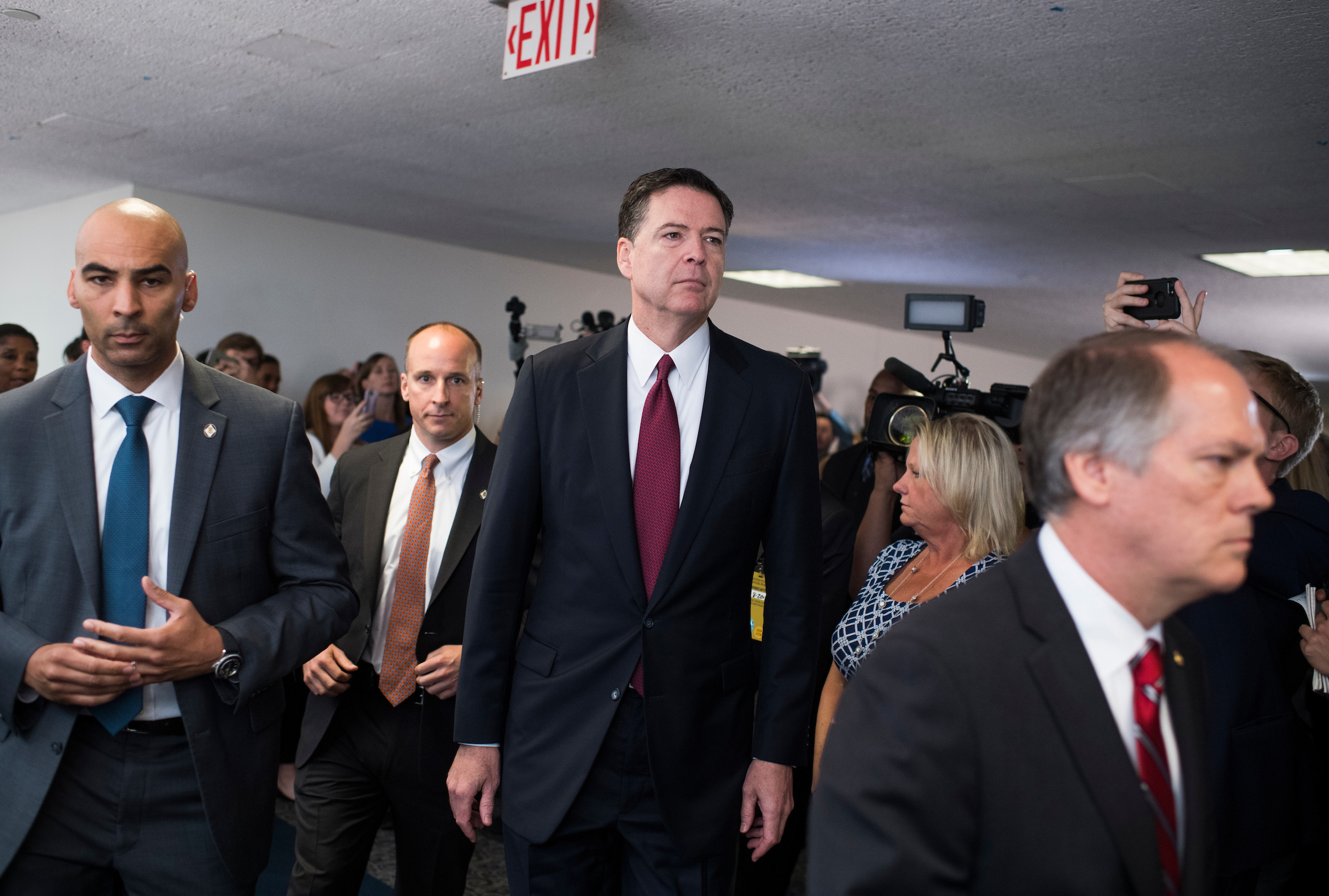 Former FBI Director James Comey leaves a Senate Select Intelligence Committee hearing on Russian interference in the 2016 election on June 8, 2017. (Photo By Tom Williams/CQ Roll Call)