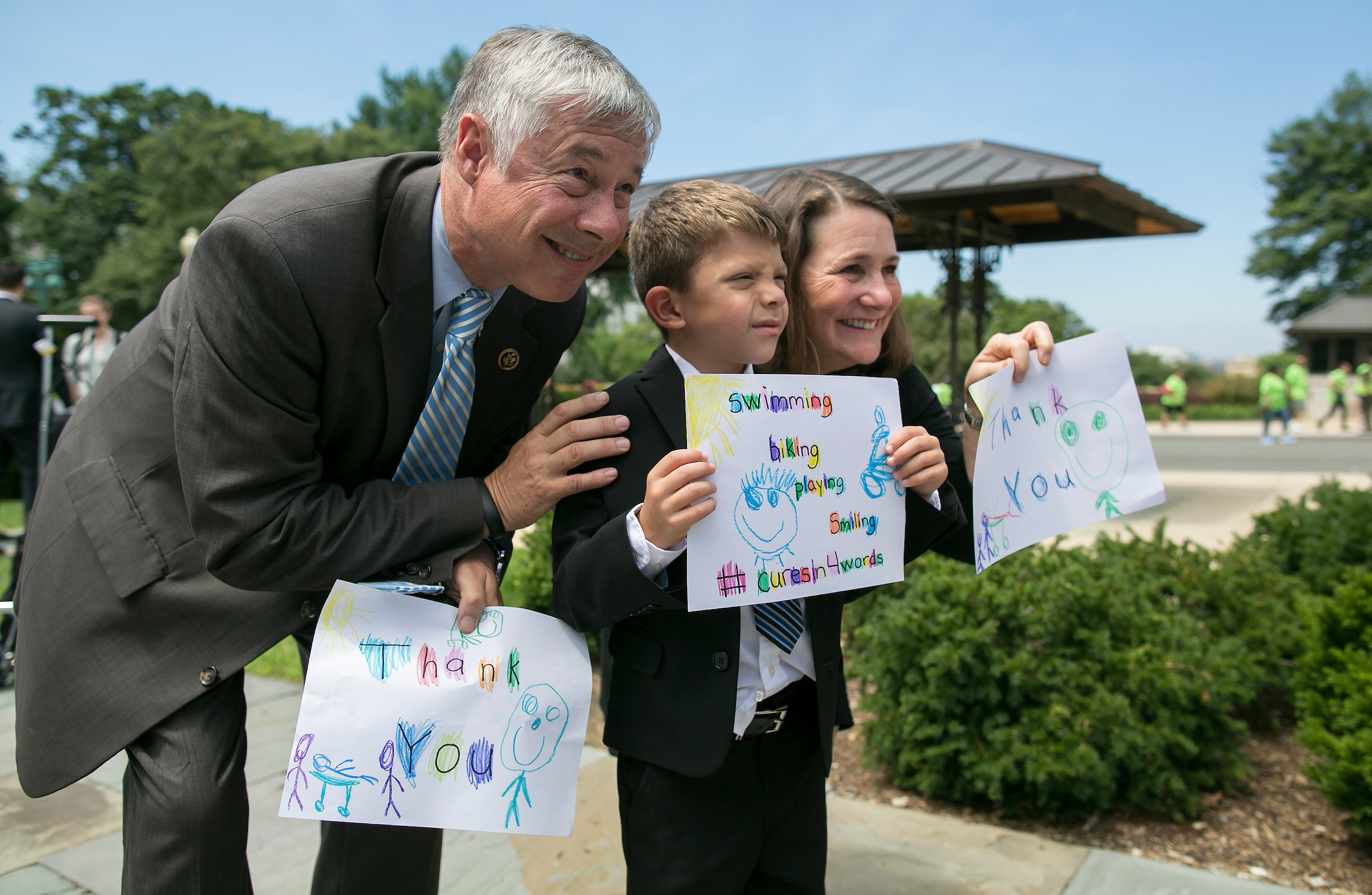 Rep. Fred Upton, R-Mich., left, and Rep. Diana DeGette, D-Colo., hold thank you signs made by Max Schill, who’s diagnosed with Noonan Syndrome, a rare genetic condition, after the U.S. House of Representatives voted in favor of the 21st Century Cures Act on Capitol Hill in Washington in 2015. Upton and DeGette spearheaded the act. (Al Drago/CQ Roll Call file photo)