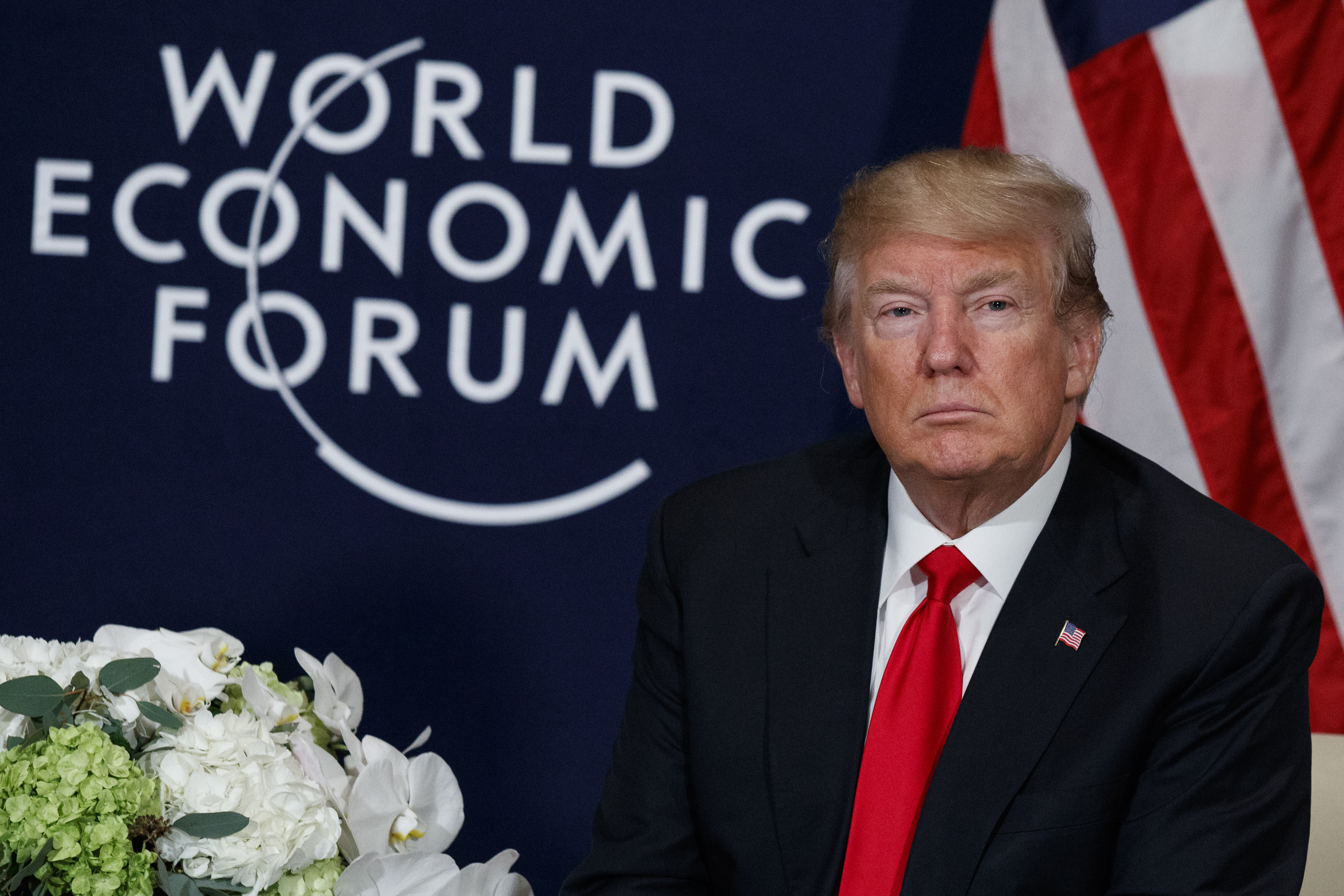 U.S. President Donald Trump listens during a meeting with Rwandan President Paul Kagame at the World Economic Forum, Friday, Jan. 26, 2018, in Davos, Switzerland. (AP Photo/Evan Vucci)