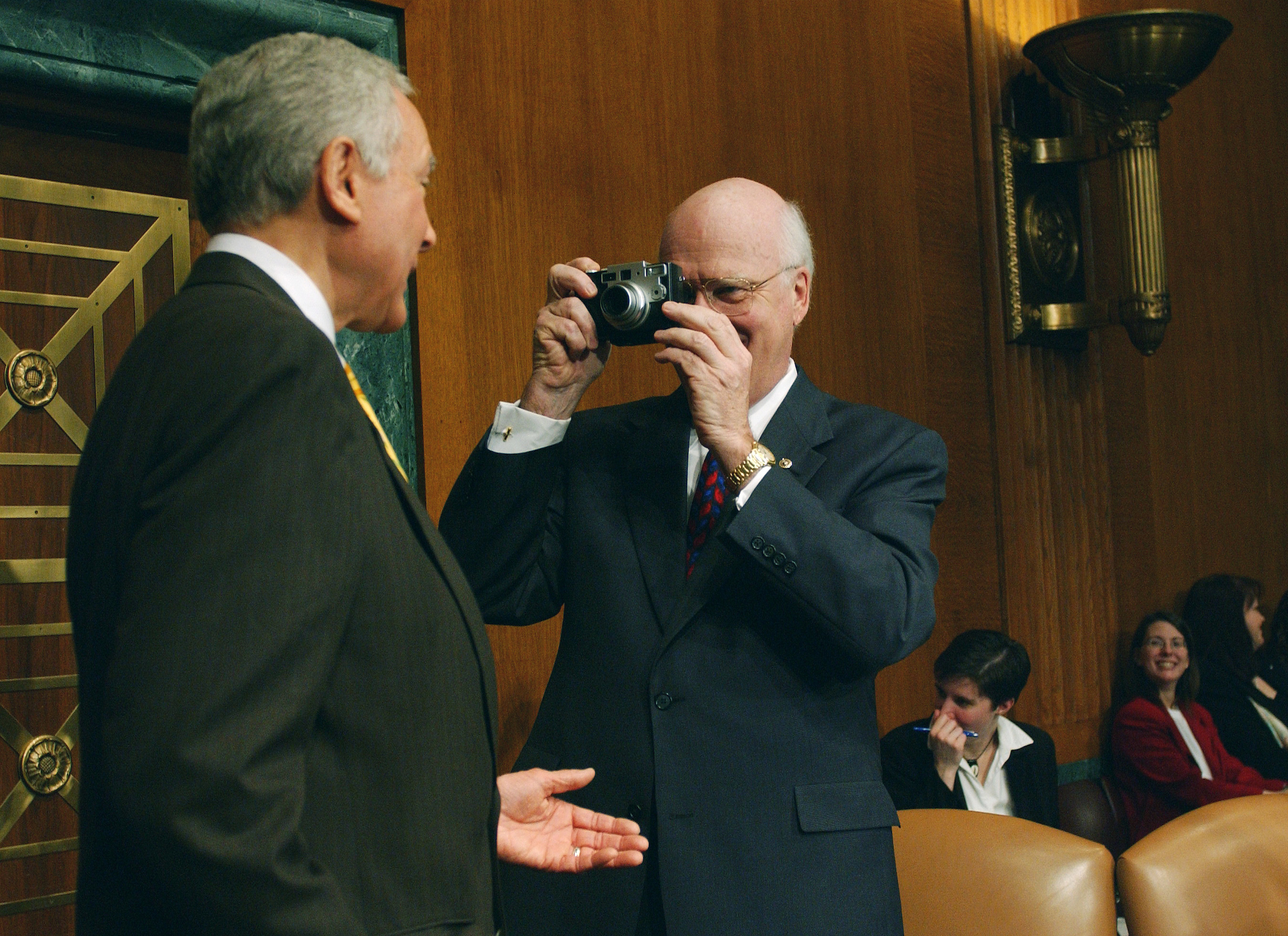 Smile! Then-Senate Judiciary Chairman Patrick J. Leahy snaps a picture of Hatch in 2002 with a digital camera he asked to see from a news photographer in the well. (Scott J. Ferrell/Congressional Quarterly)