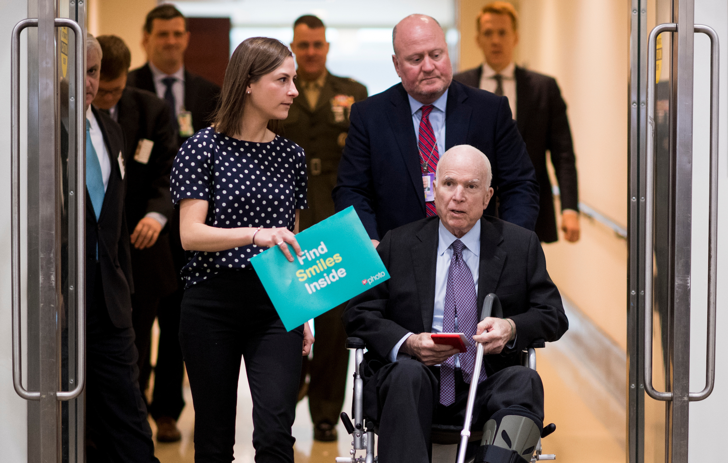 Arizona Sen. John McCain and staff make their way from the Capitol Visitor Center to the Capitol last month before he returned home to Arizona. (Bill Clark/CQ Roll Call file photo)