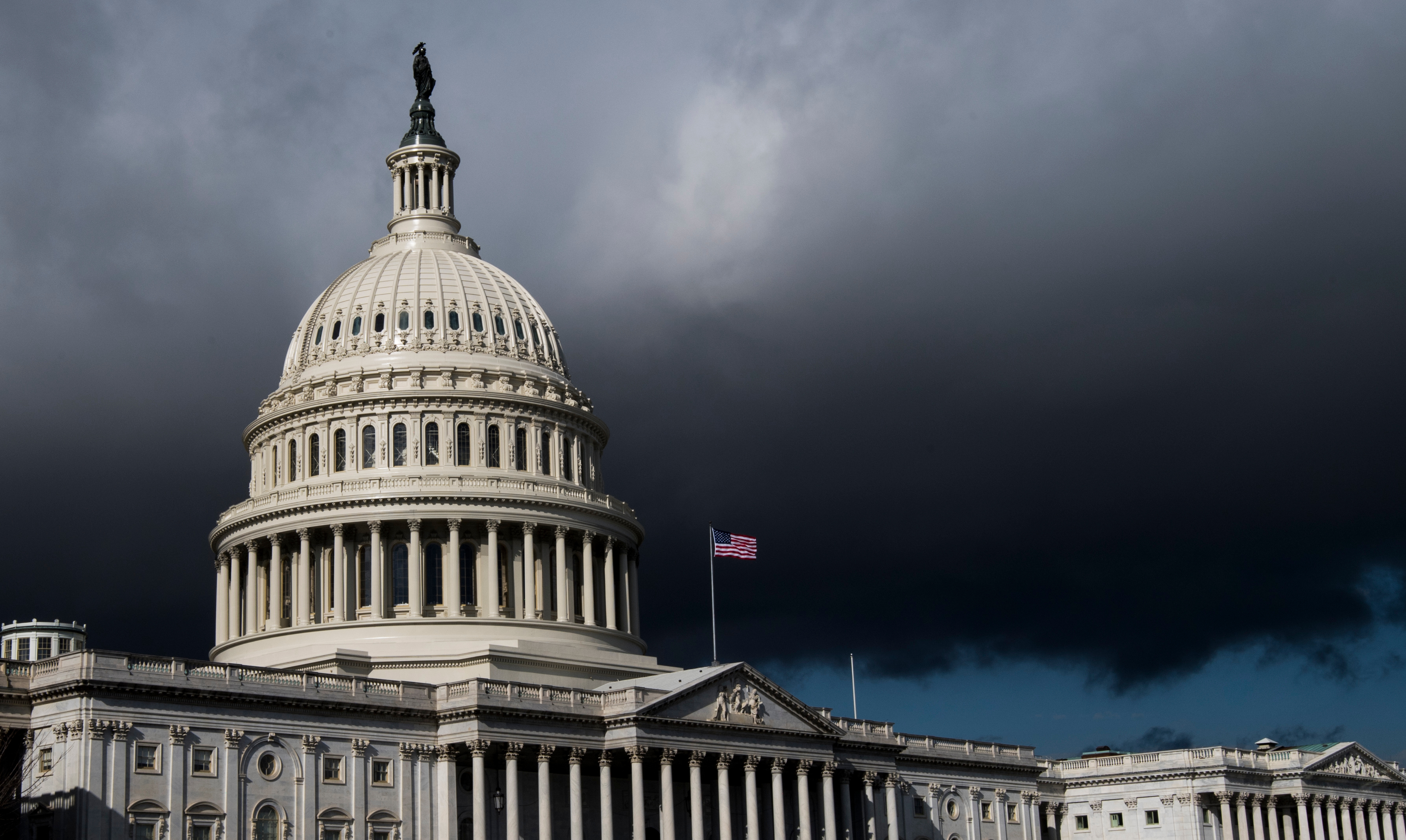 Storm clouds pass over the dome of the U.S. Capitol building on Jan. 23, 2018. (Bill Clark/CQ Roll Call file photo)